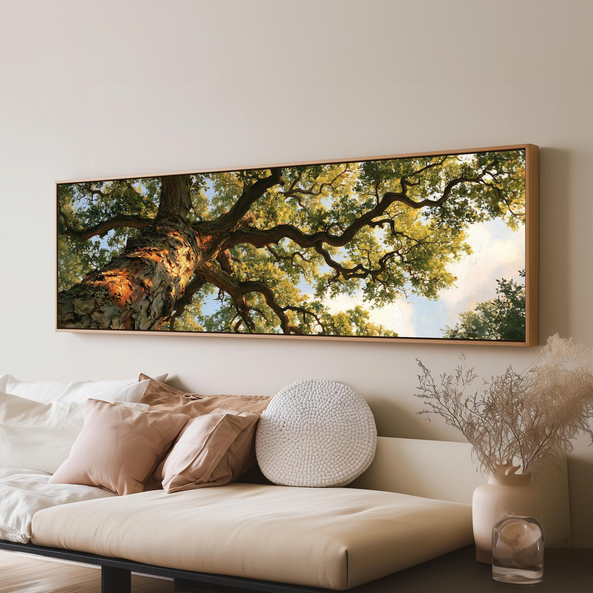Twisting oak branch from below long horizontal canvas print displayed on a wall