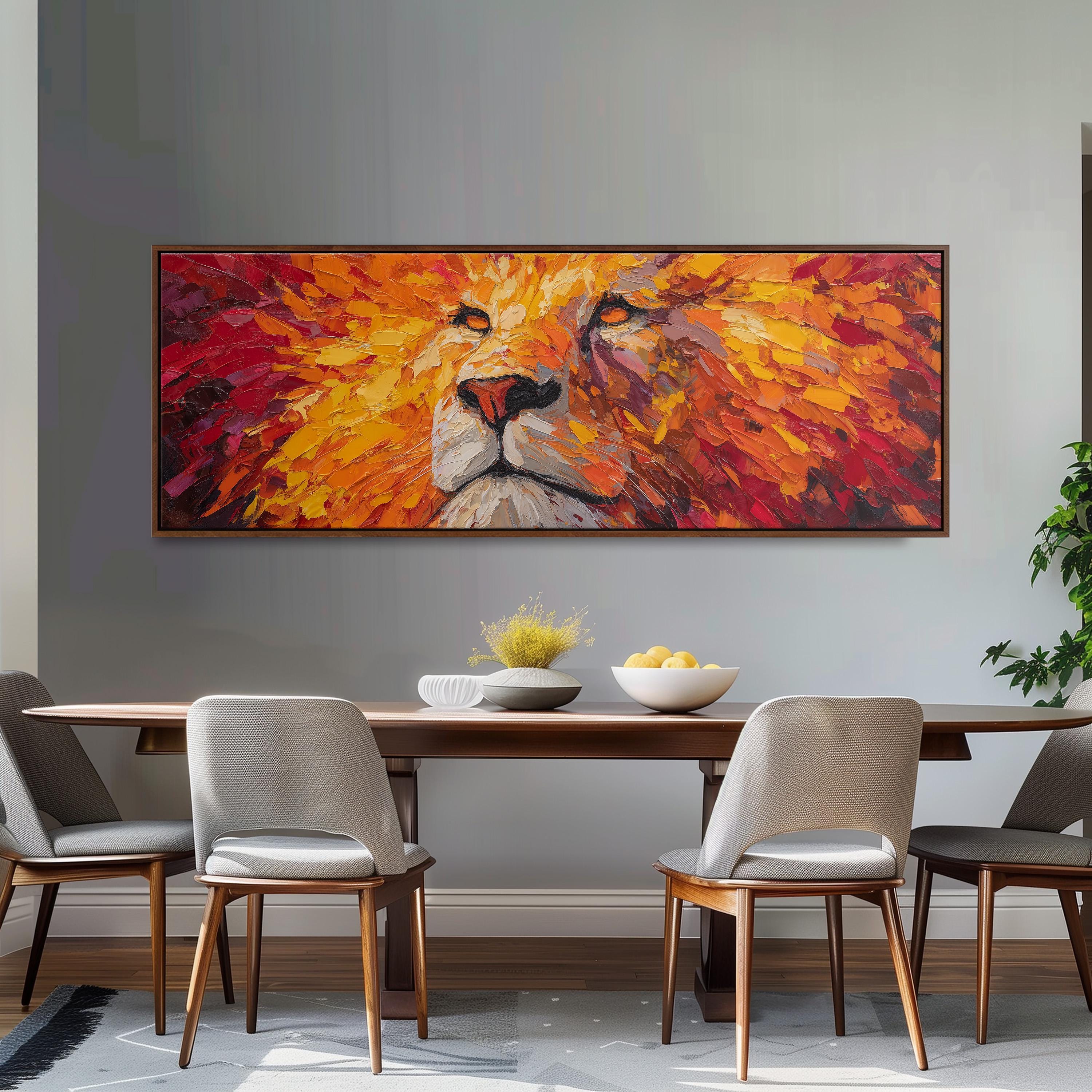 a large, colorful painting of a lion's face hanging on a wall above a wooden dining table with four chairs.