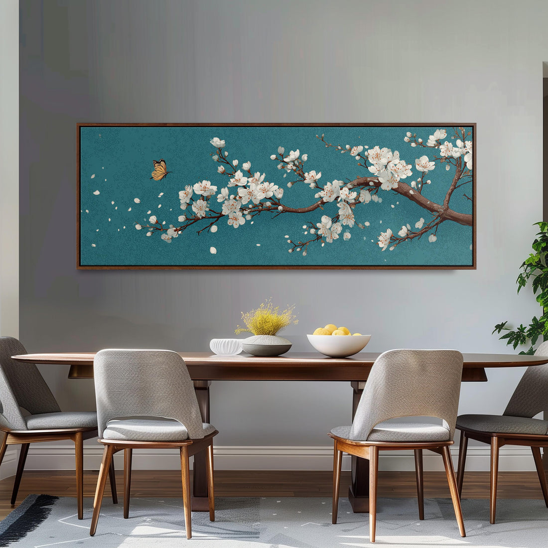 a black and white checkered sofa with a brown throw pillow, set against a dark wall with a large framed painting of a cherry blossom tree above it.