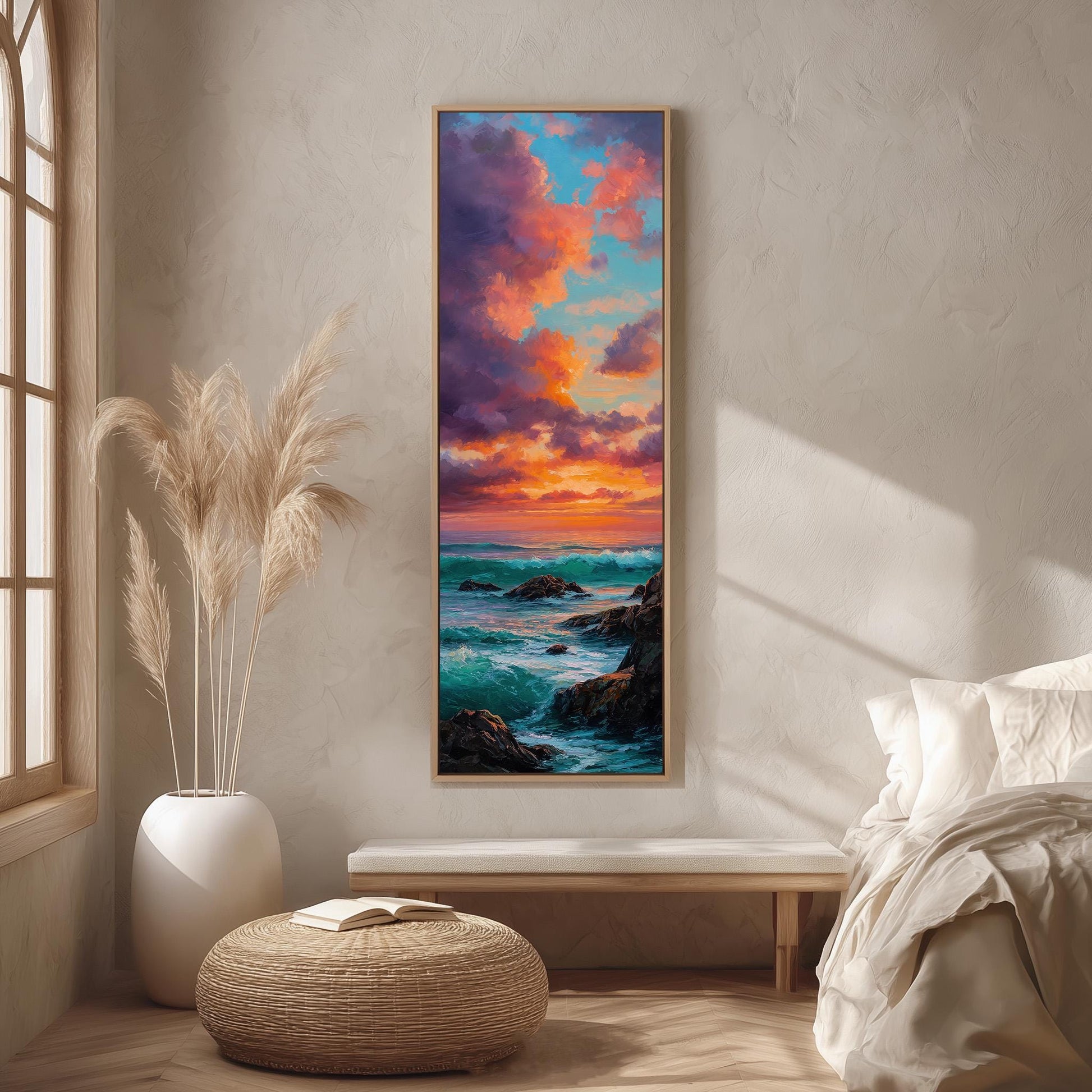 a serene bedroom scene with a large painting of a sunset over the ocean hanging on the wall. The painting is framed in a wooden frame and is the focal point of the room. The room is decorated with a large window, a white bed, a wicker ottoman, and a potted plant. The overall atmosphere of the room is calm and peaceful, with the painting adding a touch of natural beauty and color to the space.