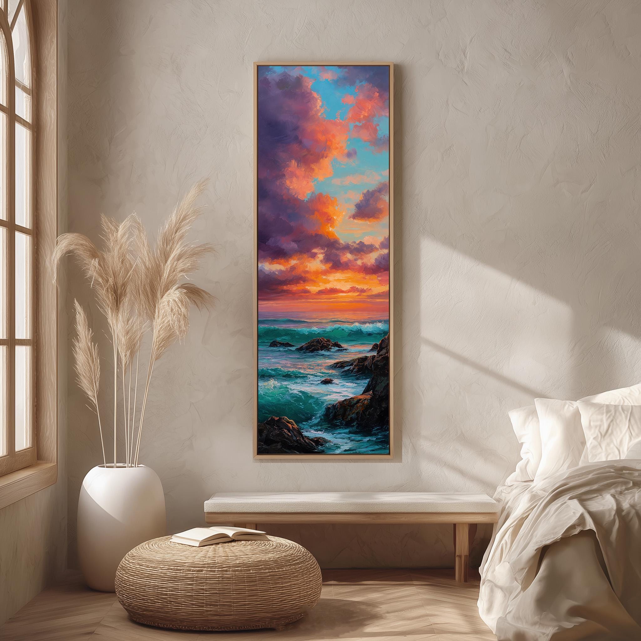 a serene bedroom scene with a large painting of a sunset over the ocean hanging on the wall. The painting is framed in a wooden frame and is the focal point of the room. The room is decorated with a large window, a white bed, a wicker ottoman, and a potted plant. The overall atmosphere of the room is calm and peaceful, with the painting adding a touch of natural beauty and color to the space.