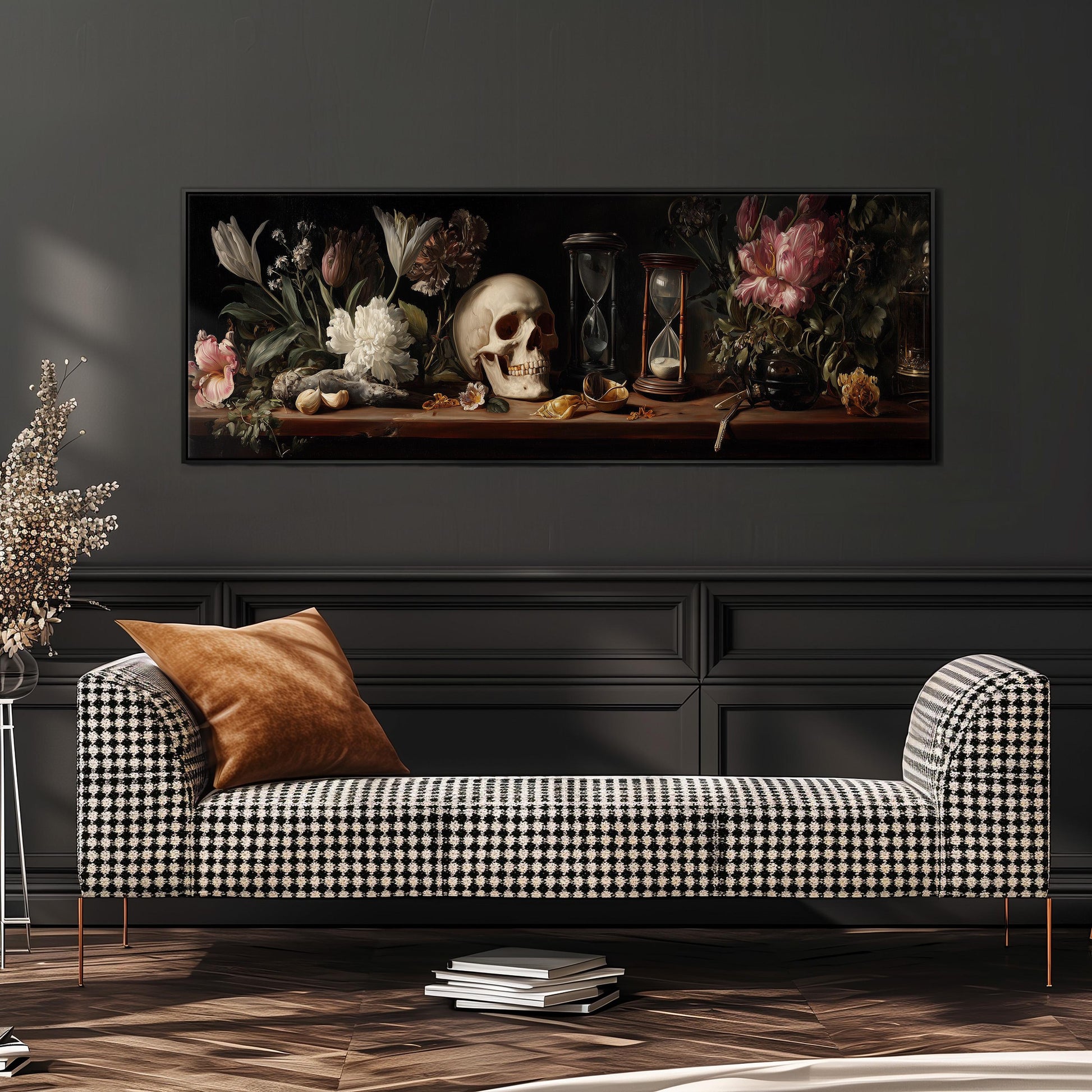 a black and white checkered sofa with a brown throw pillow, set against a dark wall with a framed painting of flowers and a skull above it.
