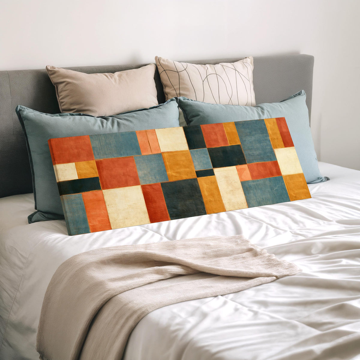 Rust, gold, navy and cream quilt blocks wide panoramic canvas print laid on a bed to show its size