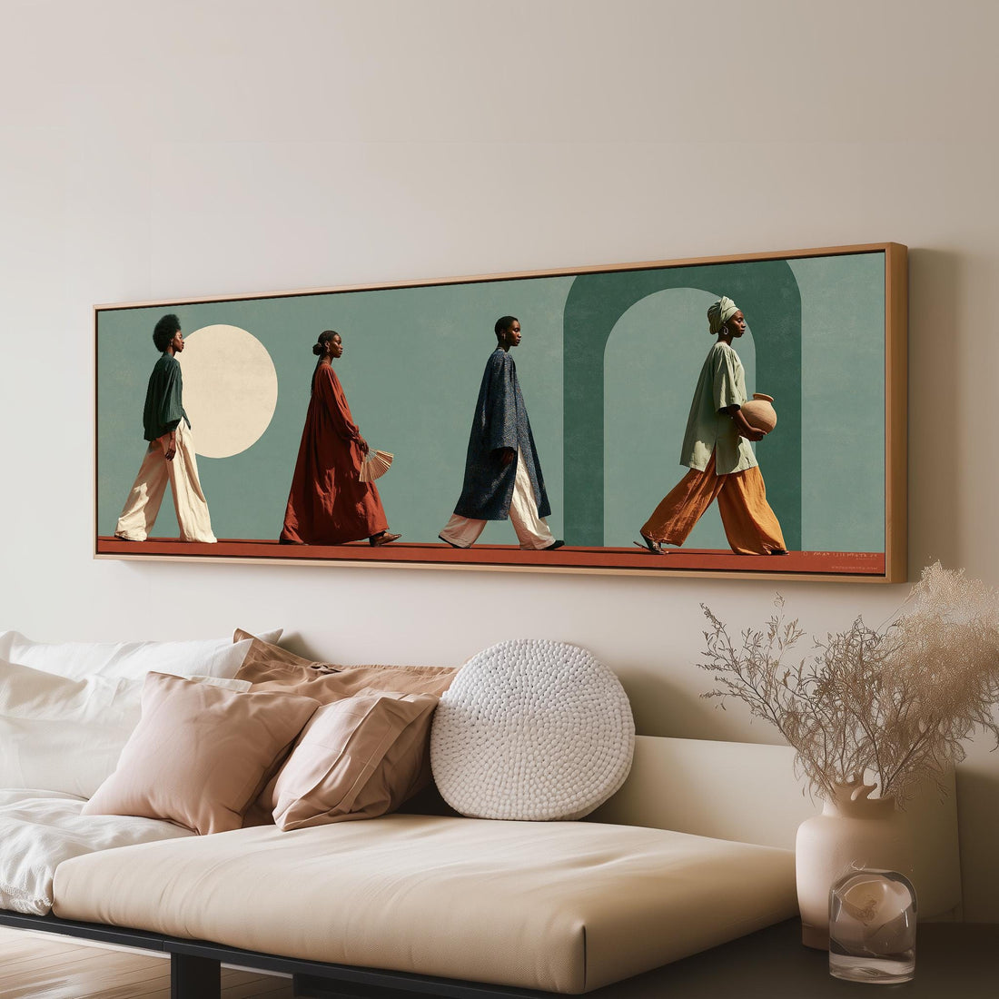 Women walking past arches and a pale moon long horizontal canvas print above a sofa in a living room