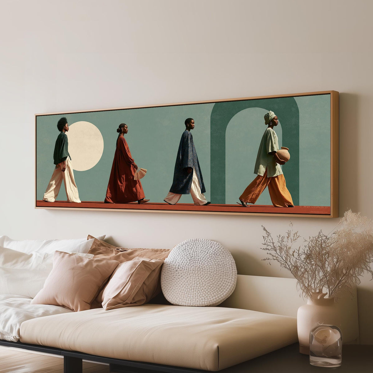 Women walking past arches and a pale moon panoramic canvas print above a sofa in a living room