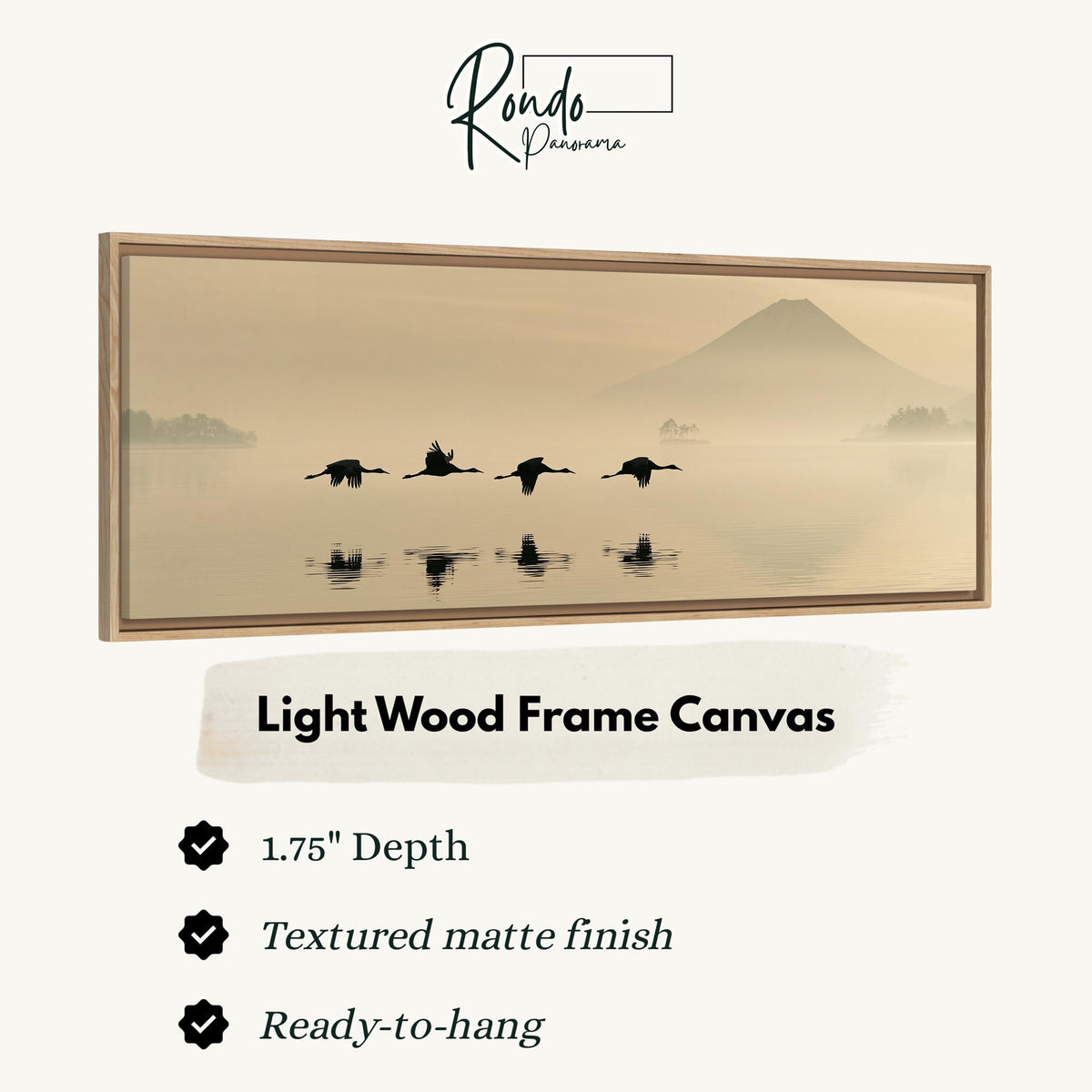 Birds flying low over a lake below Mount Fuji canvas print in a light wood floating frame