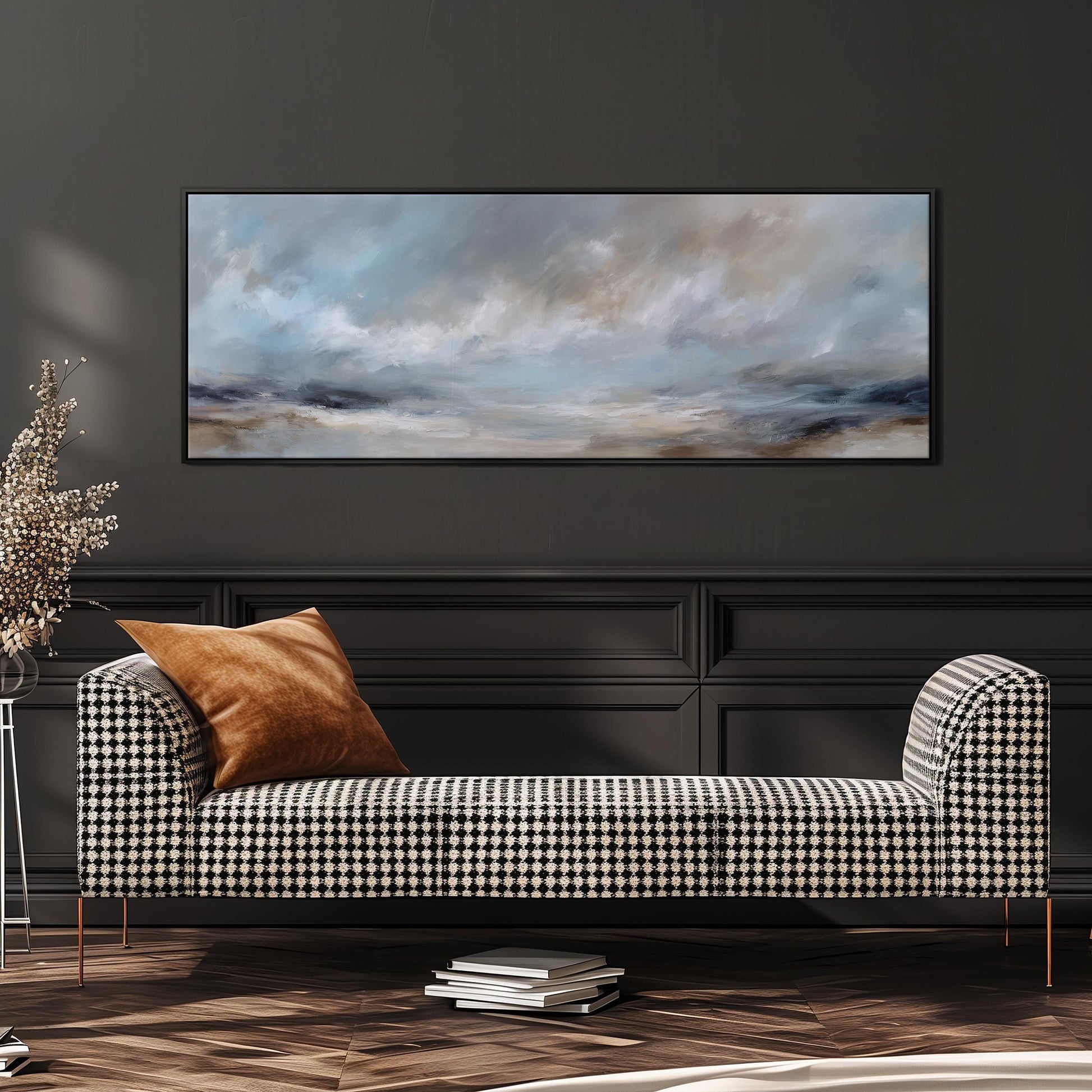a black and white checkered sofa with a brown throw pillow, set against a dark wall with a large abstract painting hanging above it.