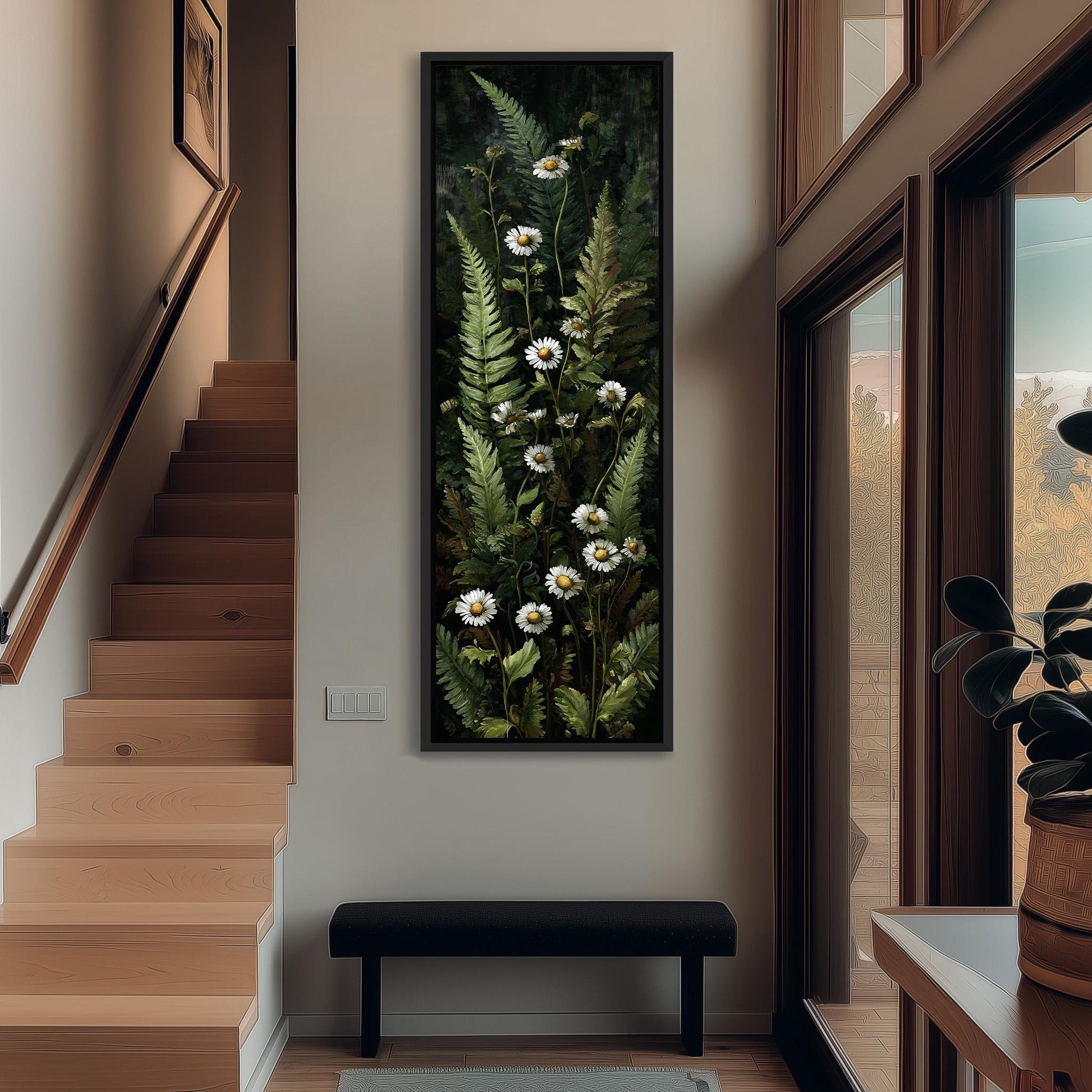 a large painting of white flowers on a wall, with a wooden staircase and a black bench in the foreground.