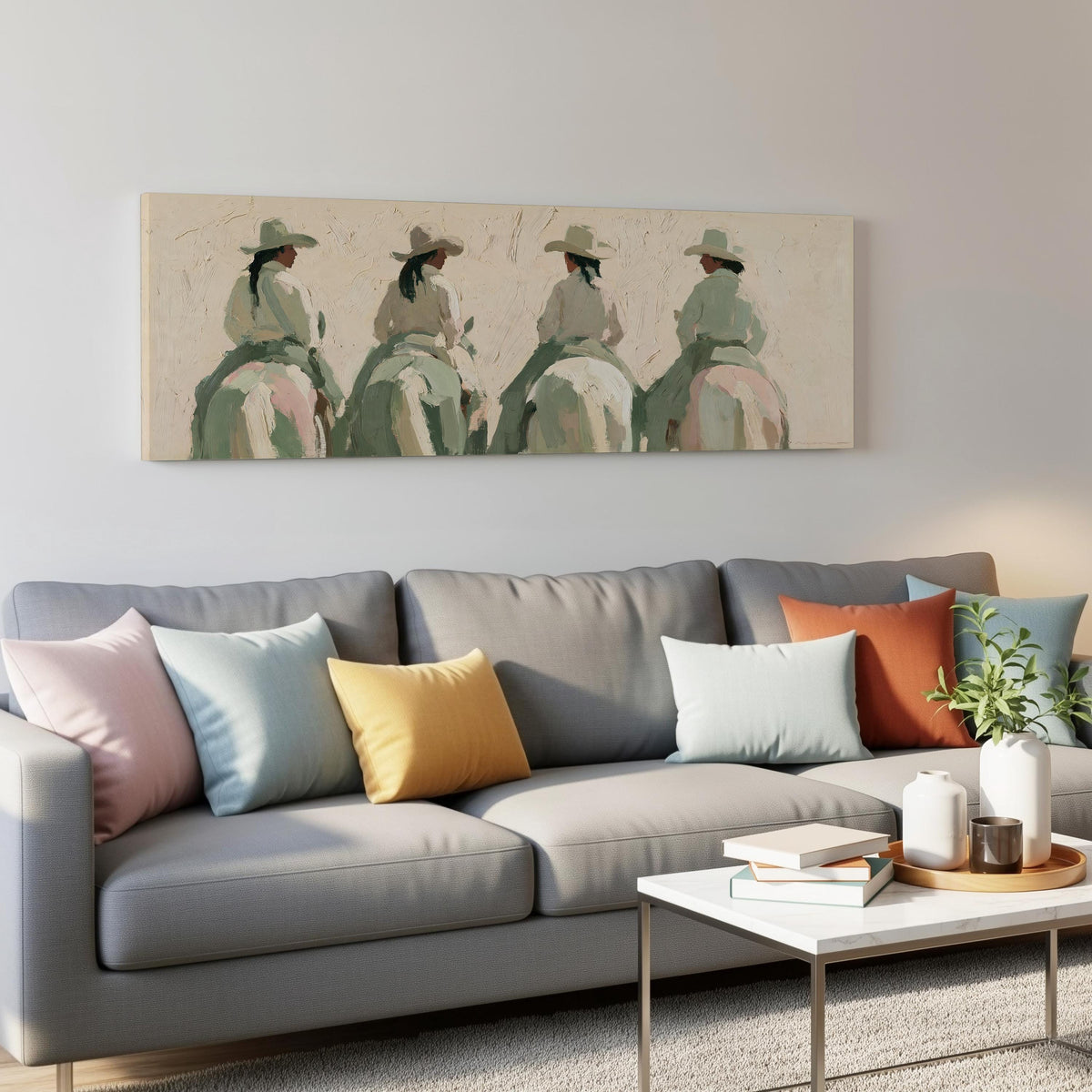 Cowgirl trail riders panoramic canvas print above a grey sofa in a living room