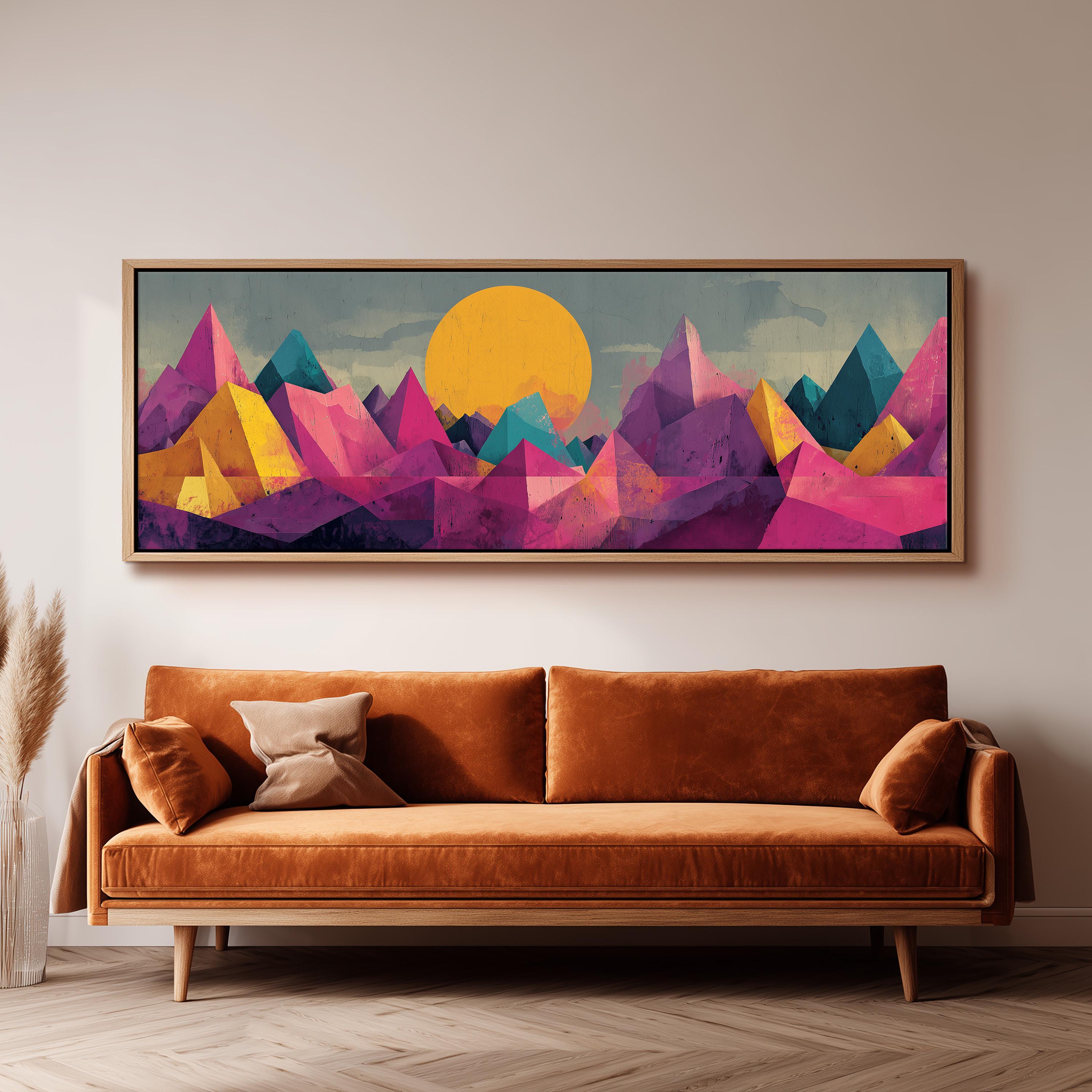 a large, colorful painting of mountains hanging on a wall above a brown sofa.