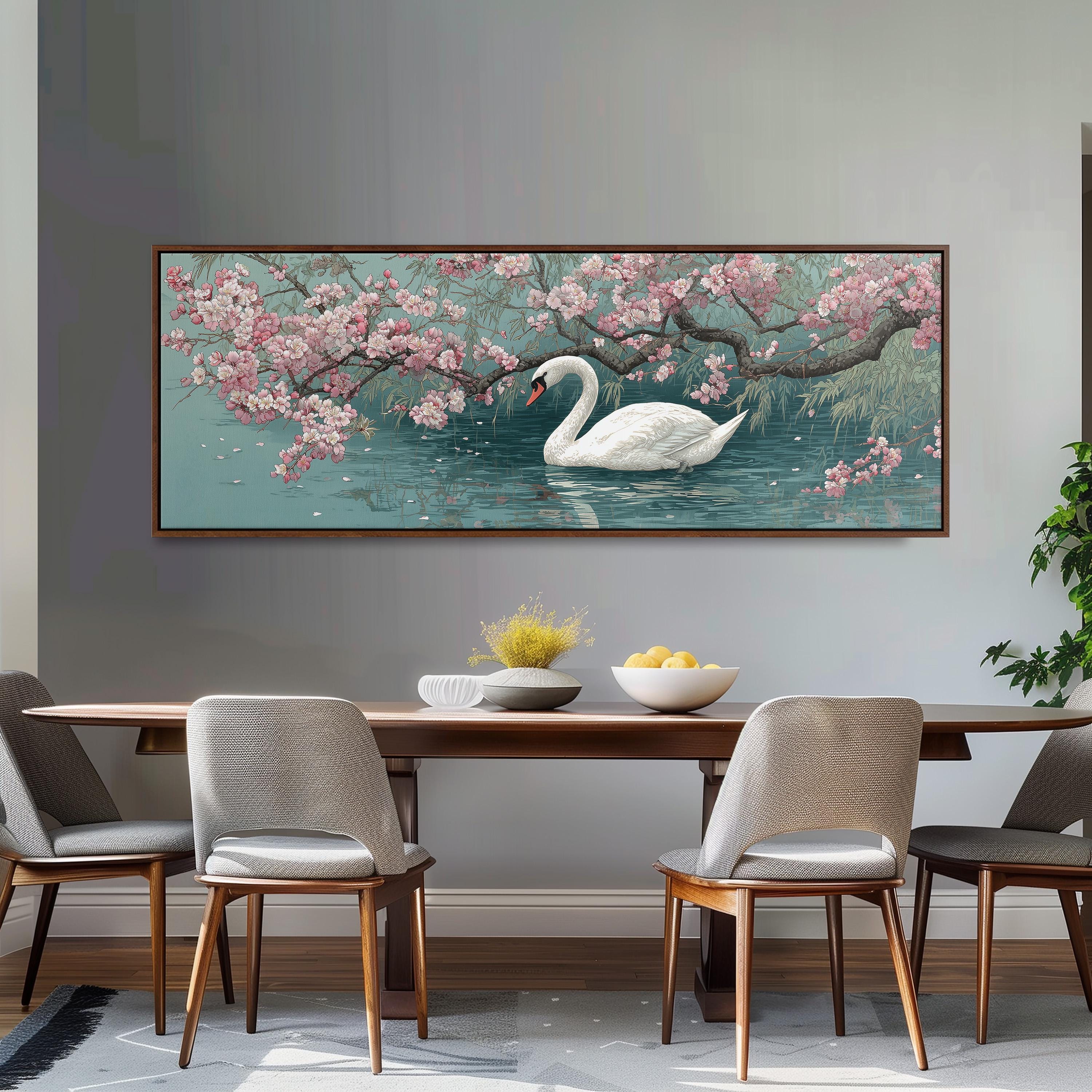 a large painting of a swan swimming in a pond with pink flowers, hanging on a wall above a wooden dining table with four chairs.