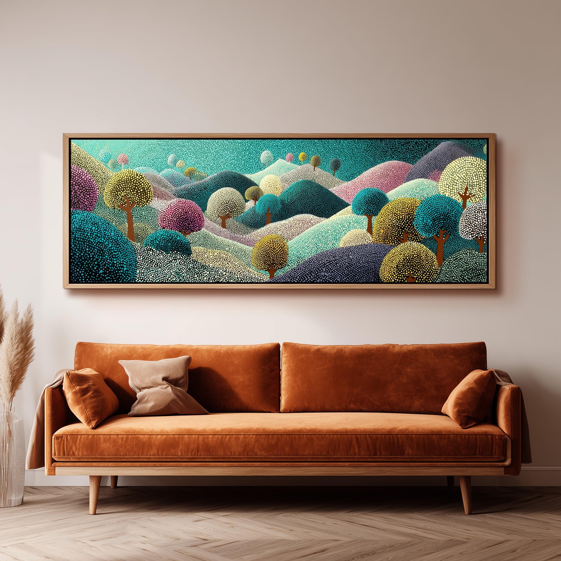 a large, colorful painting of a landscape hanging on a wall above a brown sofa.