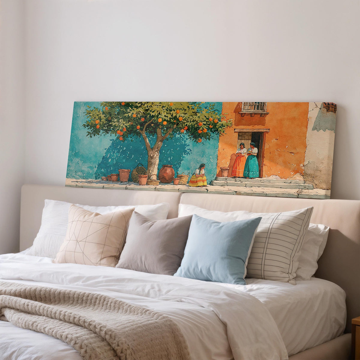 Orange tree on a colorful village street wide panoramic canvas print above a bed in a bedroom
