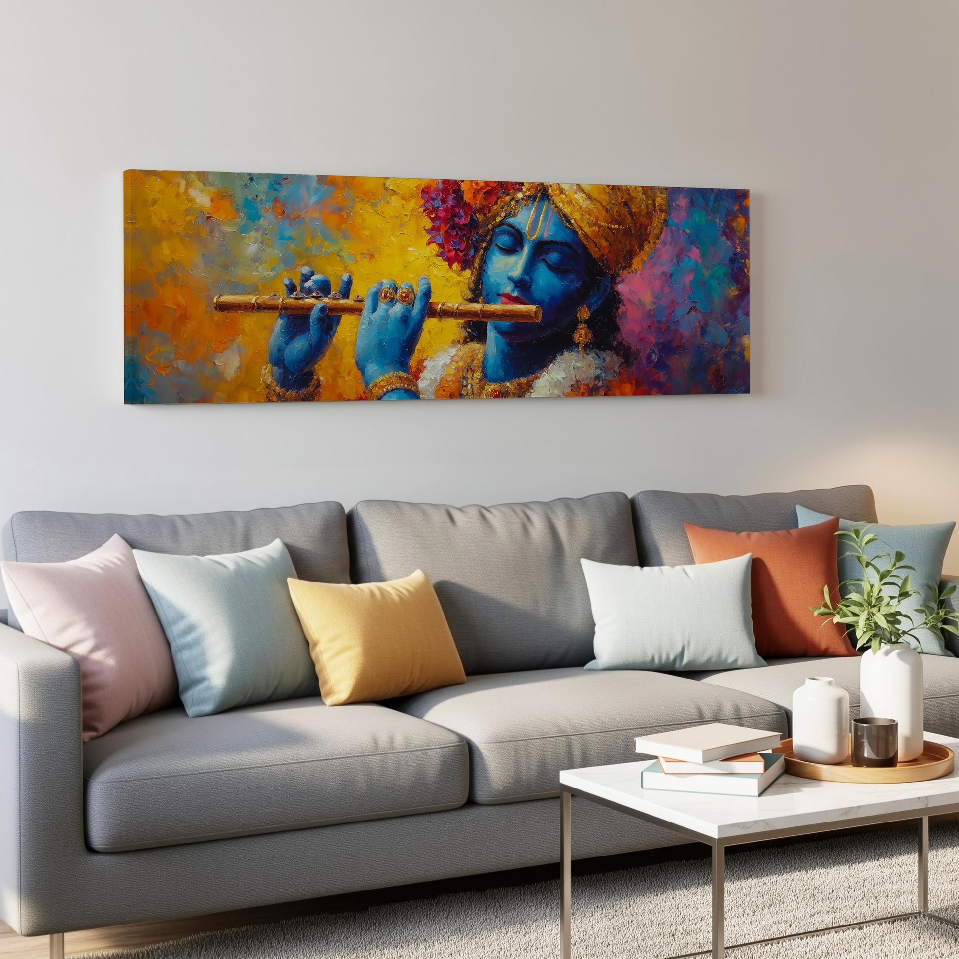 a large painting of a blue-skinned man playing a flute, hanging on a wall above a gray couch with colorful throw pillows.