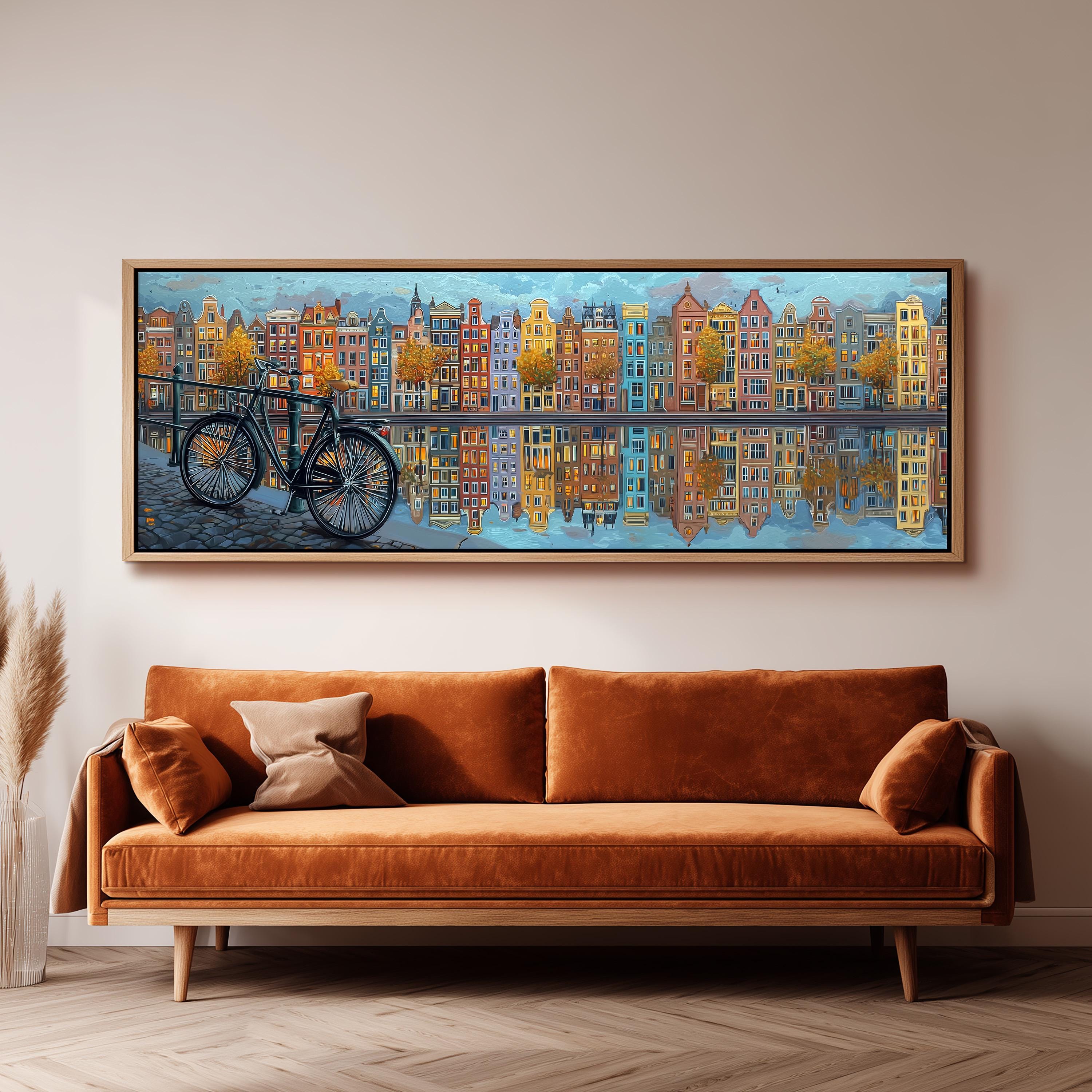 a large painting of a cityscape with a bicycle in the foreground, hanging on a wall above a brown sofa.