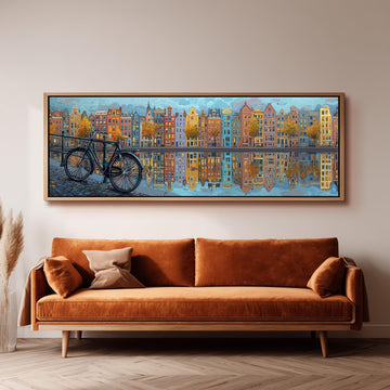 a large painting of a cityscape with a bicycle in the foreground, hanging on a wall above a brown sofa.