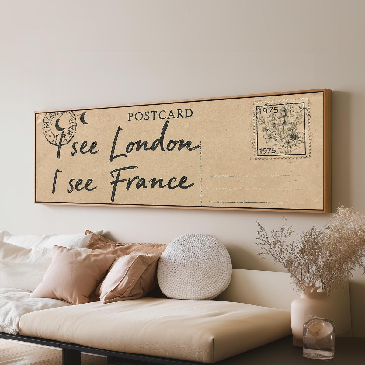 Postcard saying I see London, I see France long horizontal canvas print above a sofa in a living room