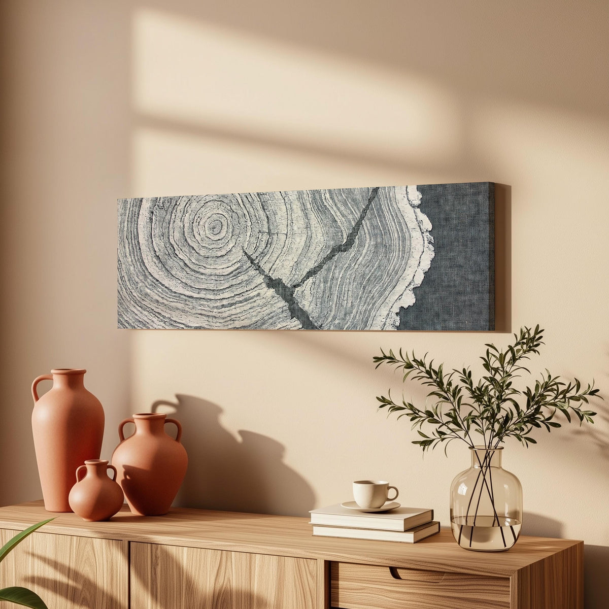 Grey tree ring on linen texture long horizontal canvas print above a wooden sideboard