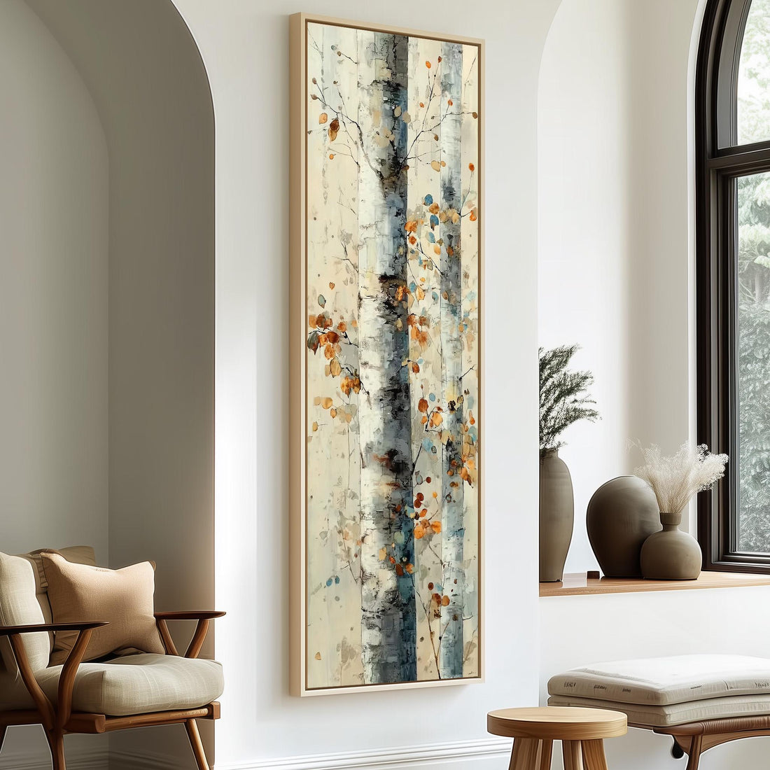 a large, abstract painting of a tree with a mix of blue, white, and orange colors, hanging on a white wall in a room with a wooden chair and a small table.