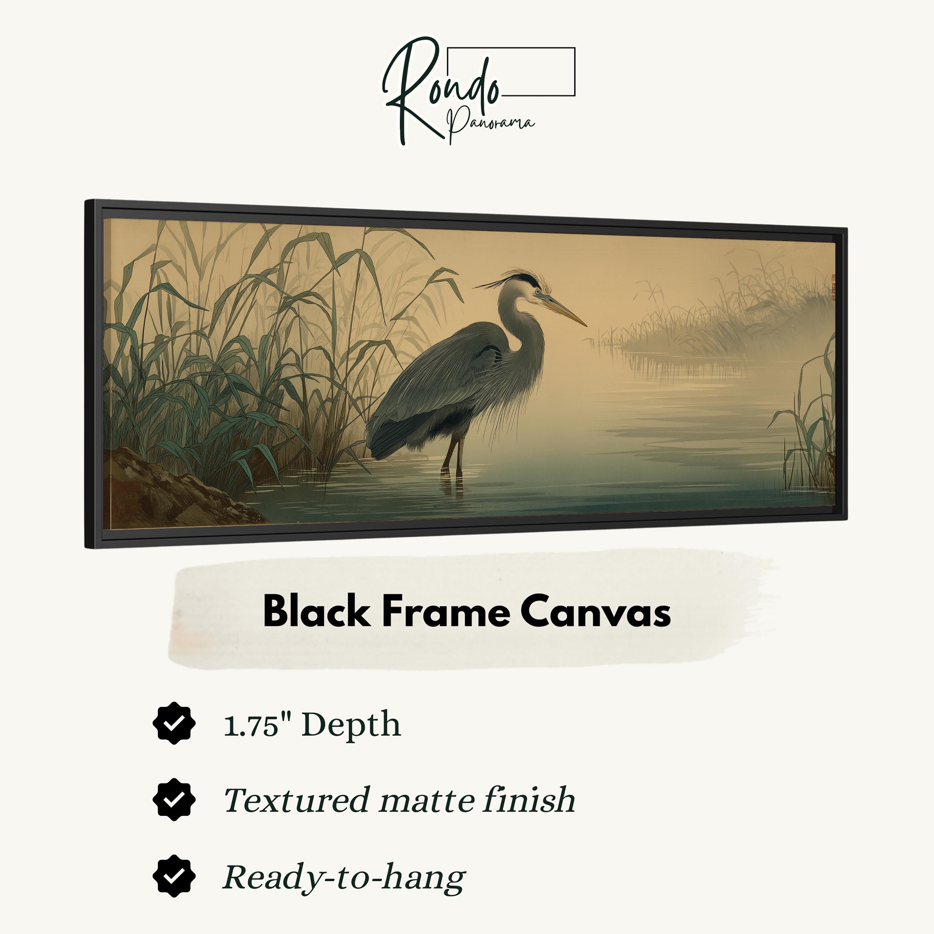 The image is a black frame canvas depicting a heron standing in a body of water.