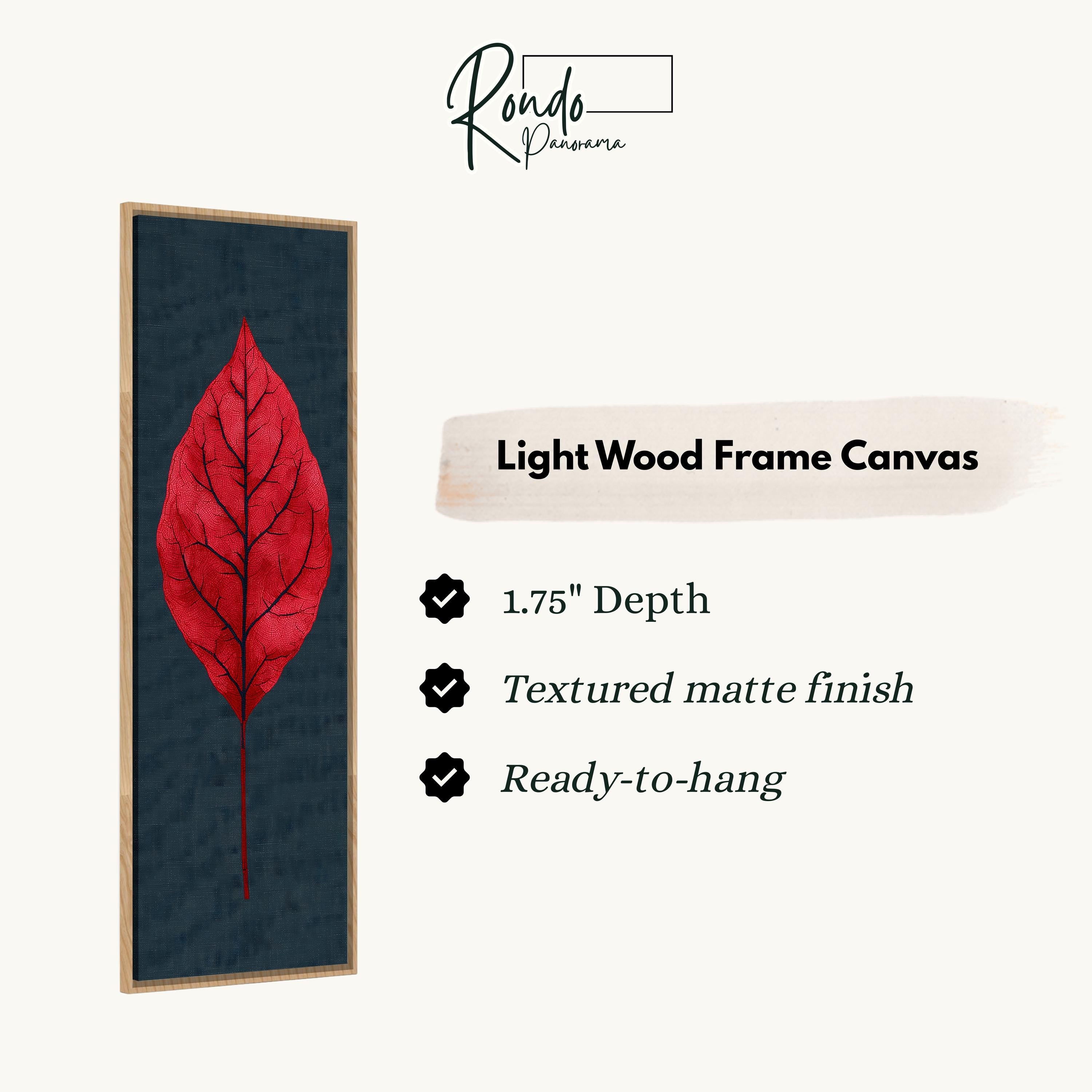 a red leaf on a dark background, with a light wood frame.