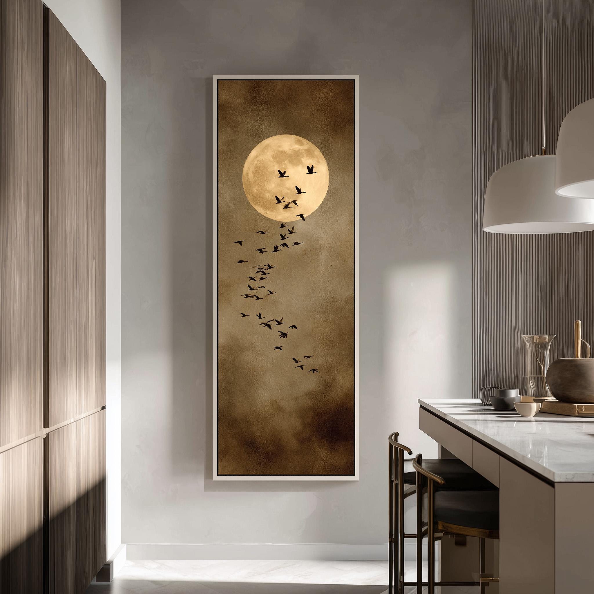 a large framed artwork depicting a flock of birds flying against a backdrop of a full moon.