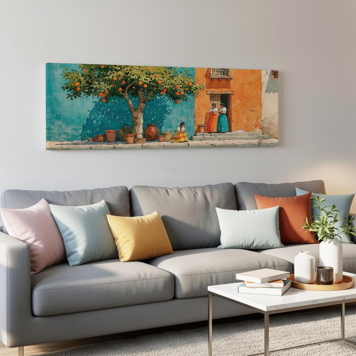 Orange tree on a colorful village street panoramic canvas print above a grey sofa in a living room