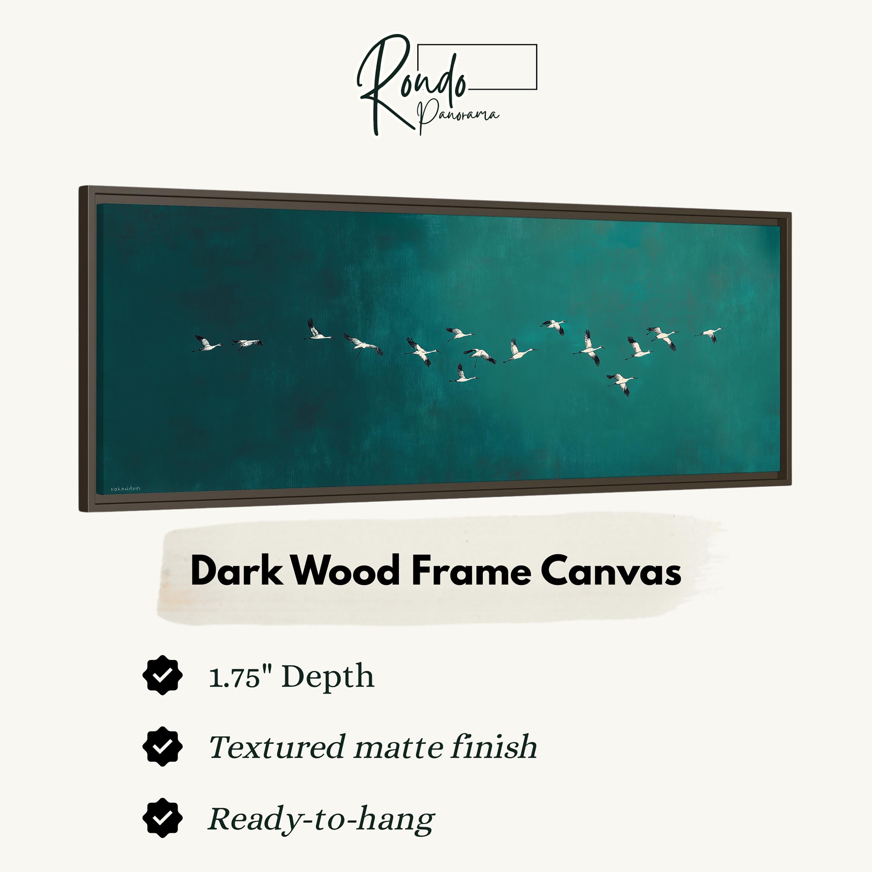 a dark wood frame canvas with a painting of a flock of birds flying across a dark blue sky.