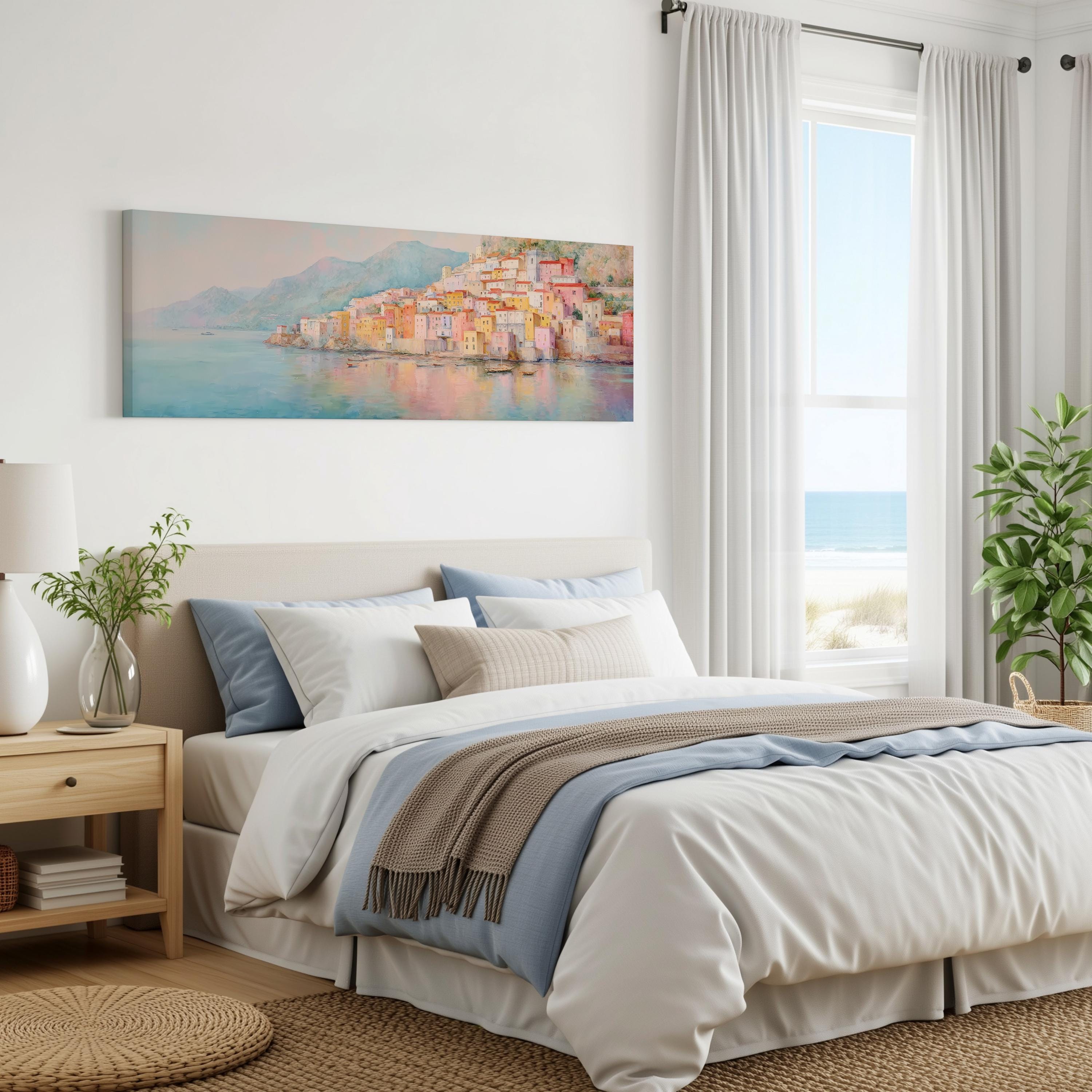 a serene bedroom with a large bed, a nightstand, and a painting of a coastal town on the wall. The room has a calming color scheme and features a large window that offers a view of the ocean.
