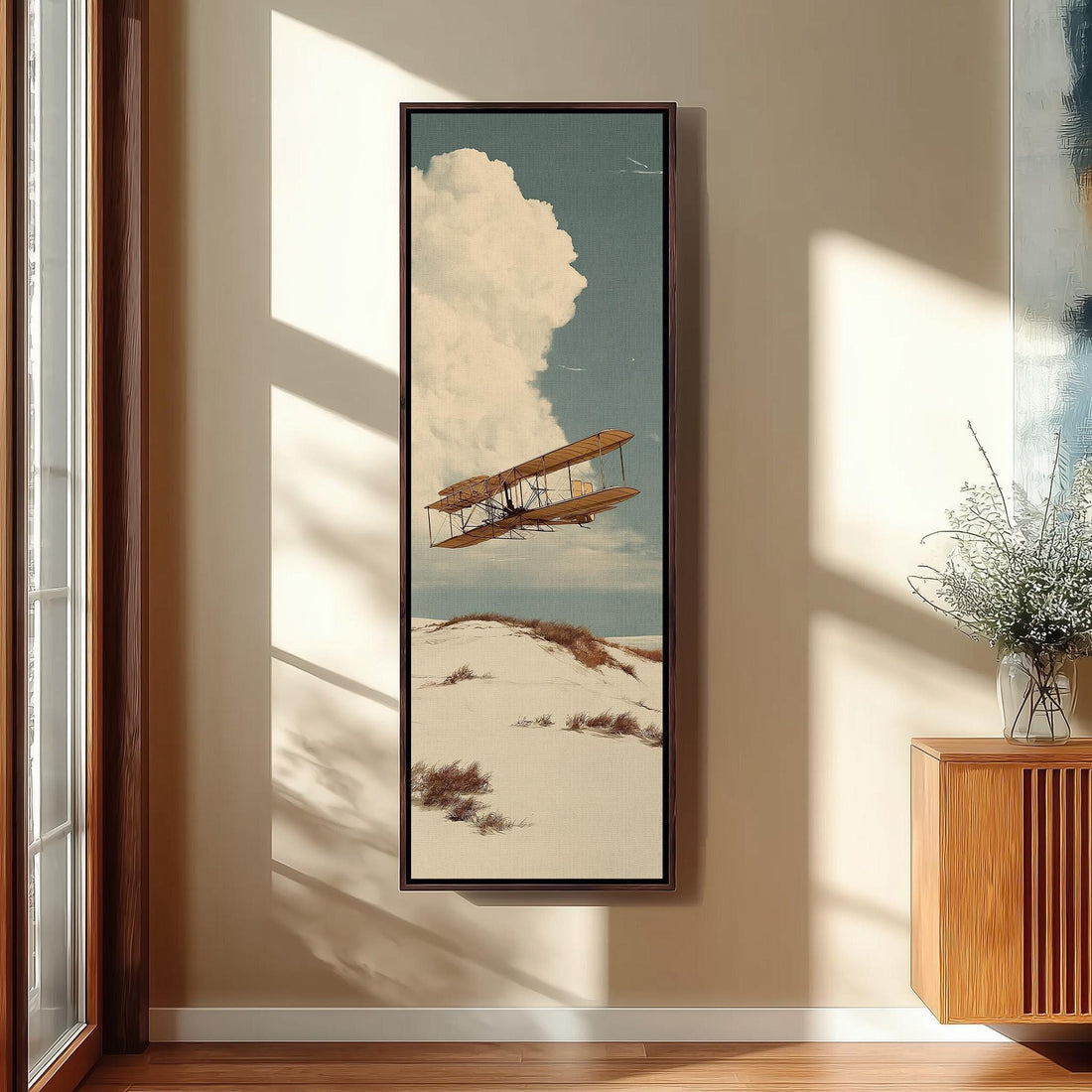 Vintage biplane over desert dunes long vertical canvas print in a sunlit living space