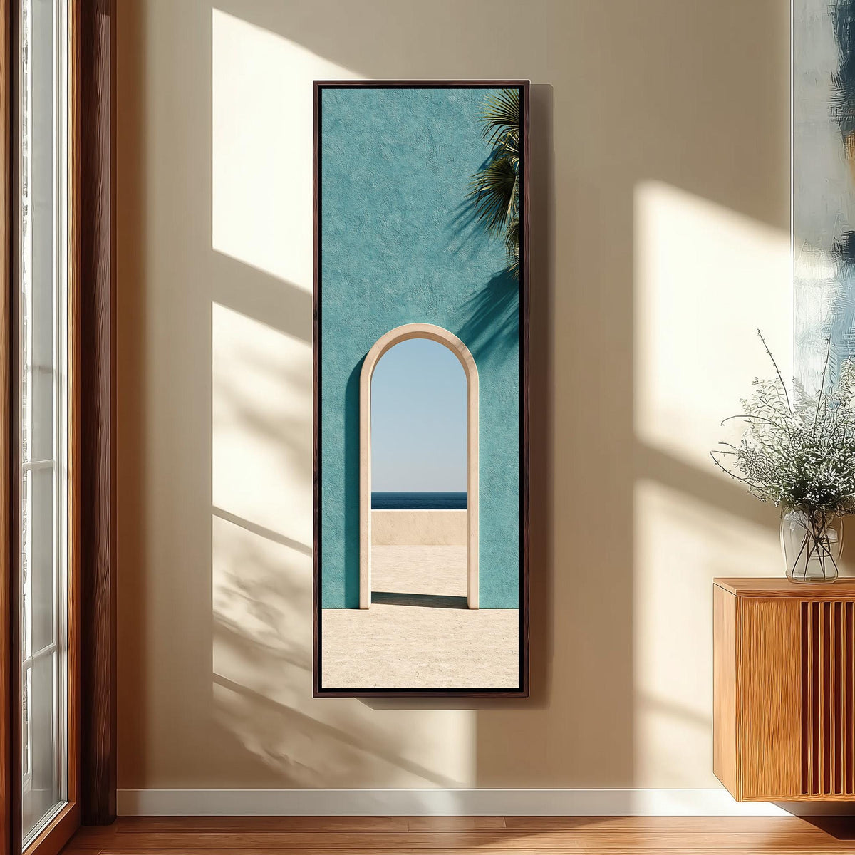 Arched doorway in a teal wall opening to the sea tall skinny canvas print in a sunlit living space