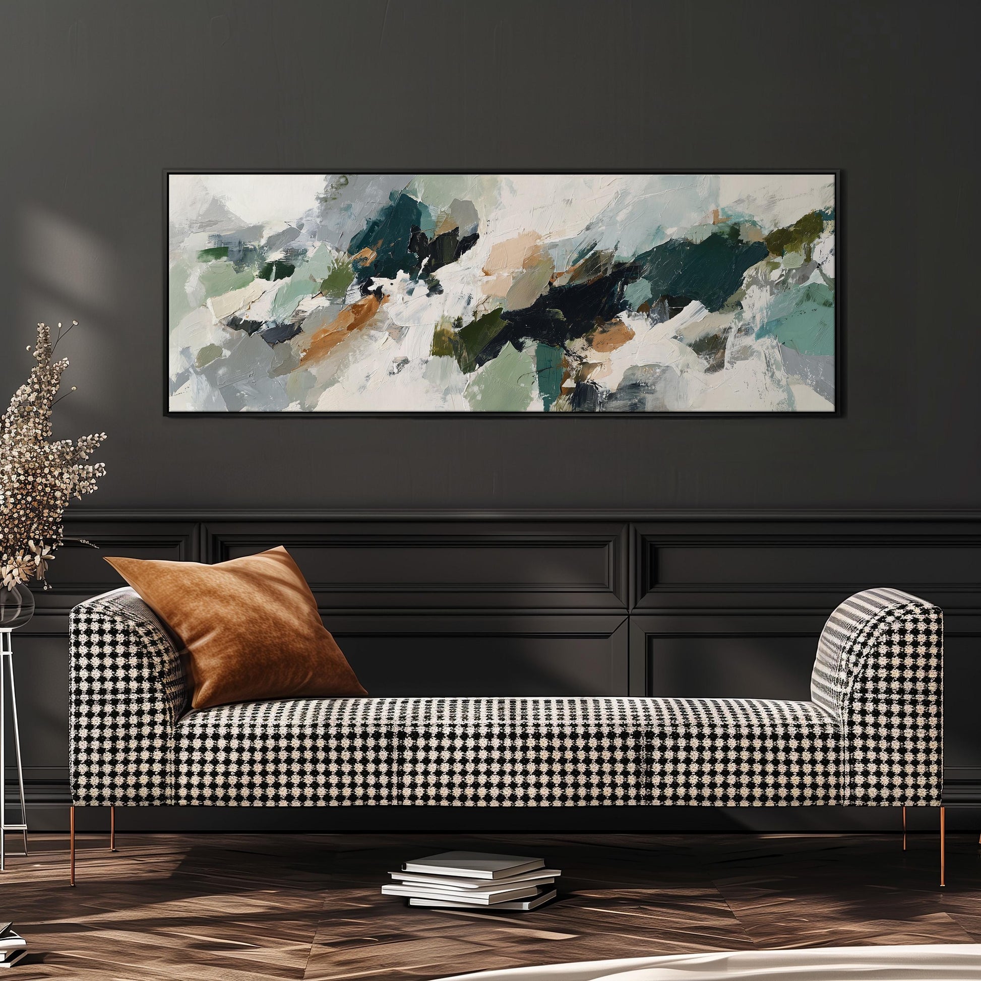 a modern living room with a black and white checkered sofa, a large abstract painting on the wall, and a stack of books on the floor.