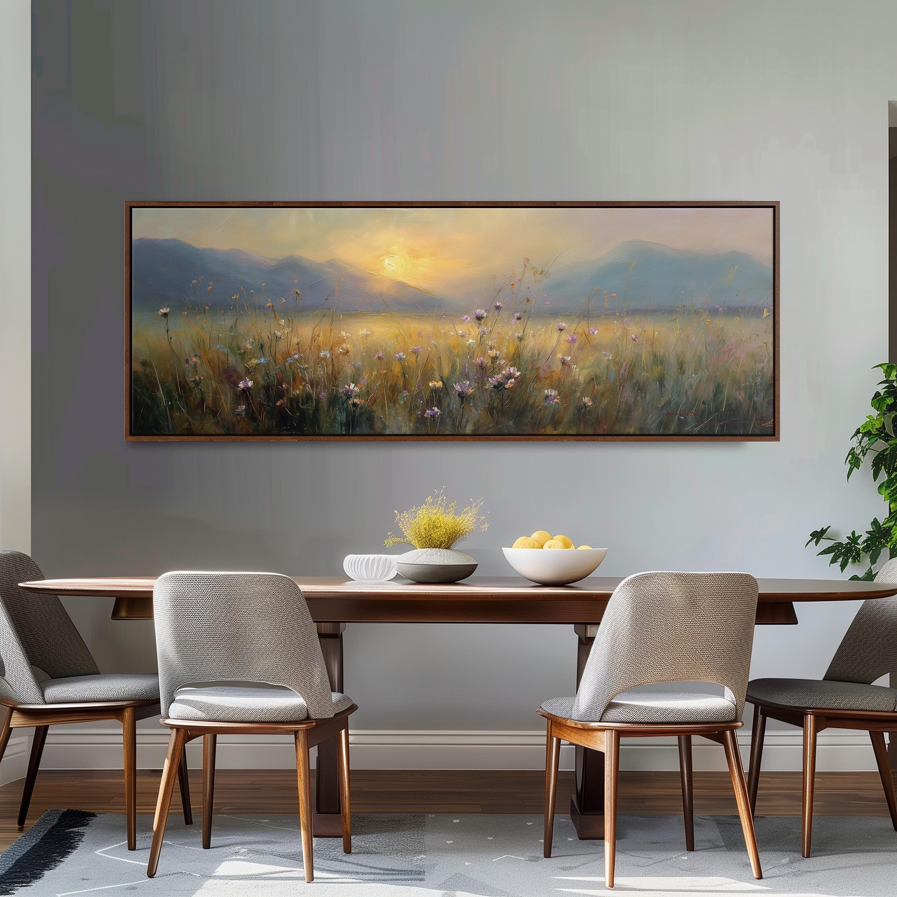 a dining room with a large painting of a field of flowers hanging on the wall above a wooden dining table with four chairs. The table is set with a bowl of fruit and a vase of flowers, creating a cozy and inviting atmosphere.