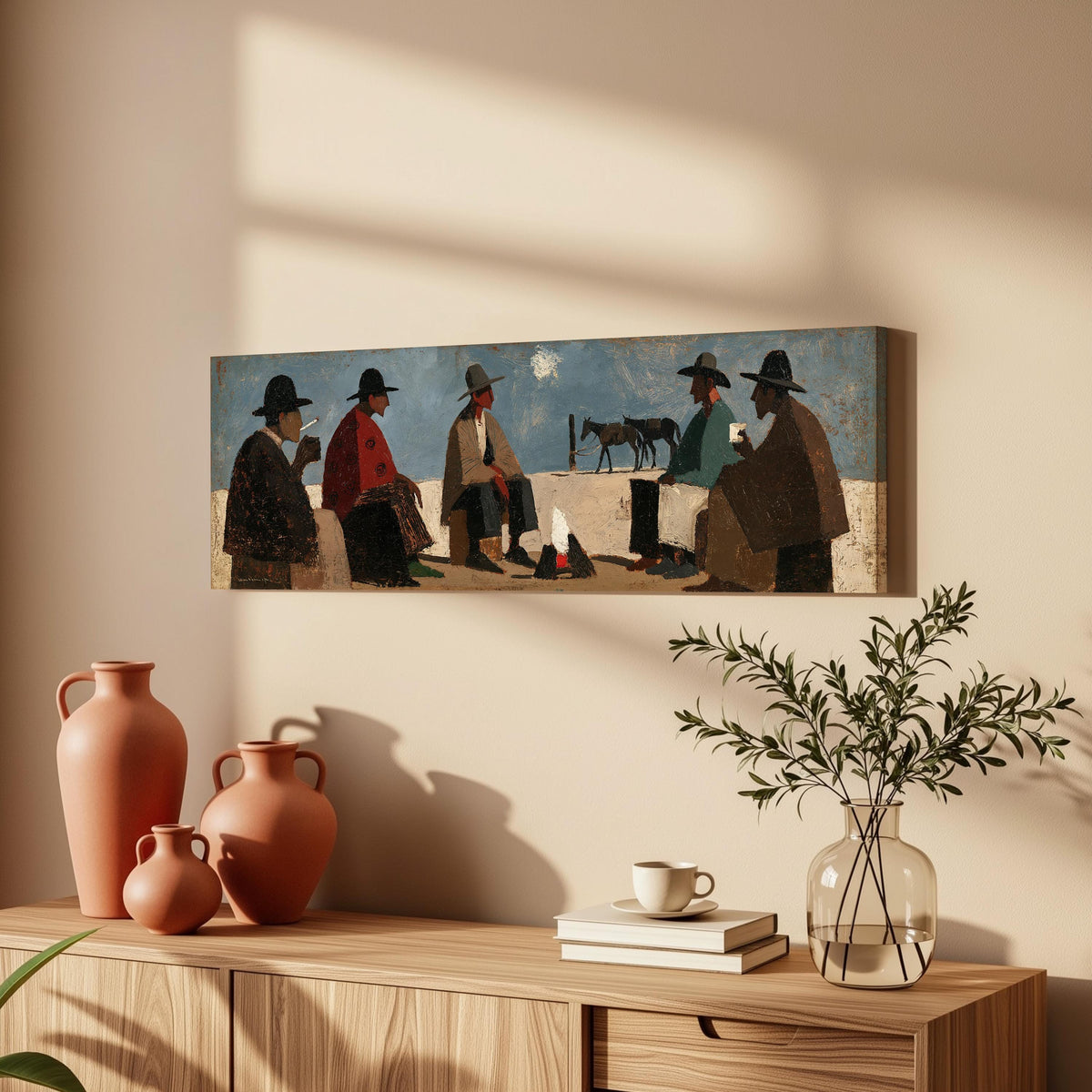 Cowboys gathered around a campfire long horizontal canvas print above a wooden sideboard