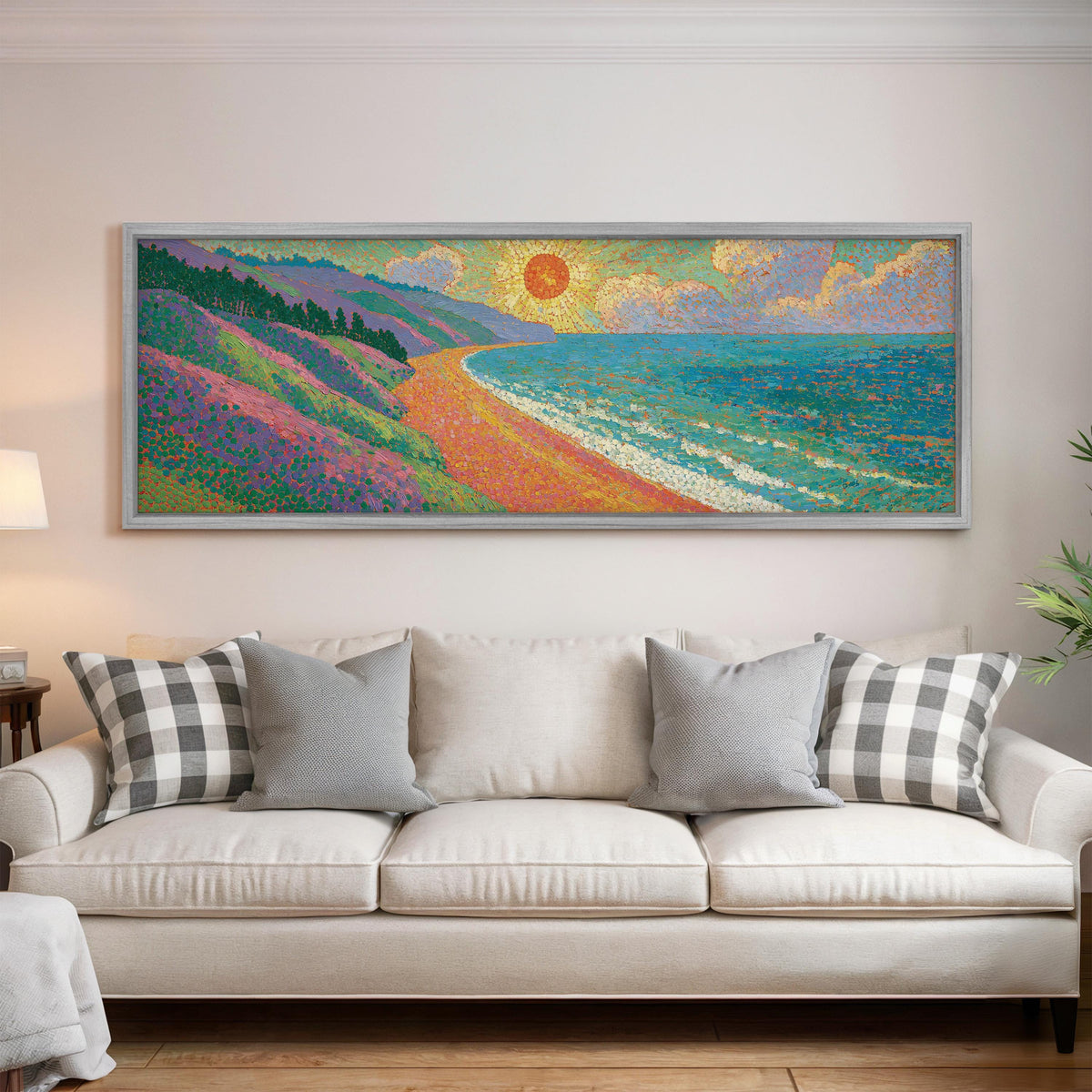 Coastal cliffs at sunset panoramic canvas print above a white sofa in a bright living room