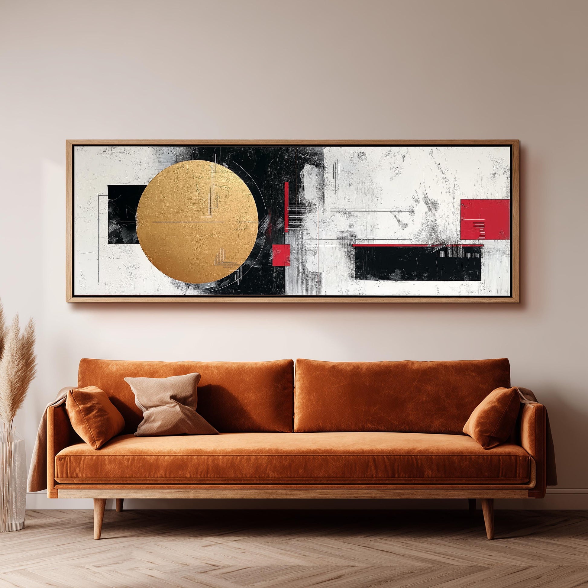 a large abstract painting hanging on a wall above a brown sofa.