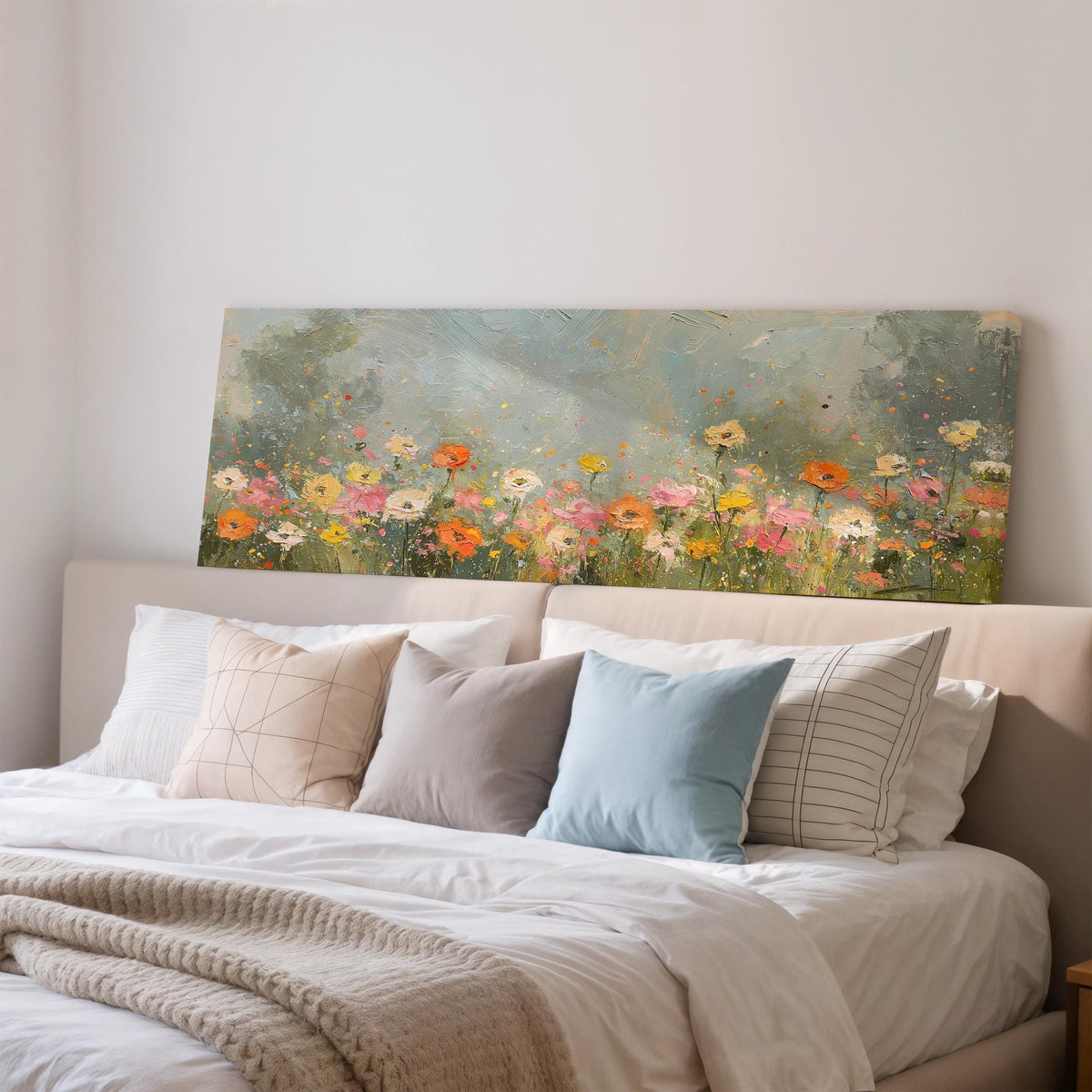 Impressionist wildflower meadow wide panoramic canvas print above a bed in a bedroom