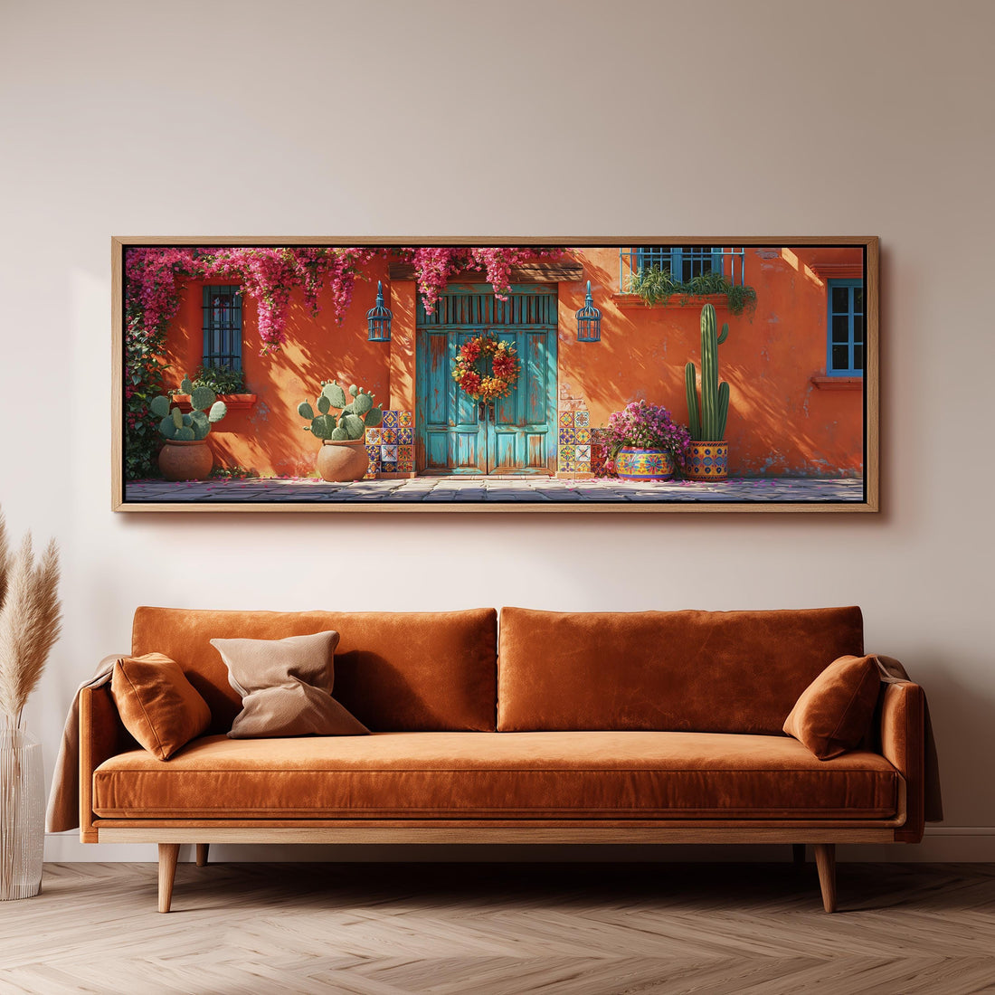 Adobe doorway with a wreath and cacti long horizontal canvas print above a sofa in a living room
