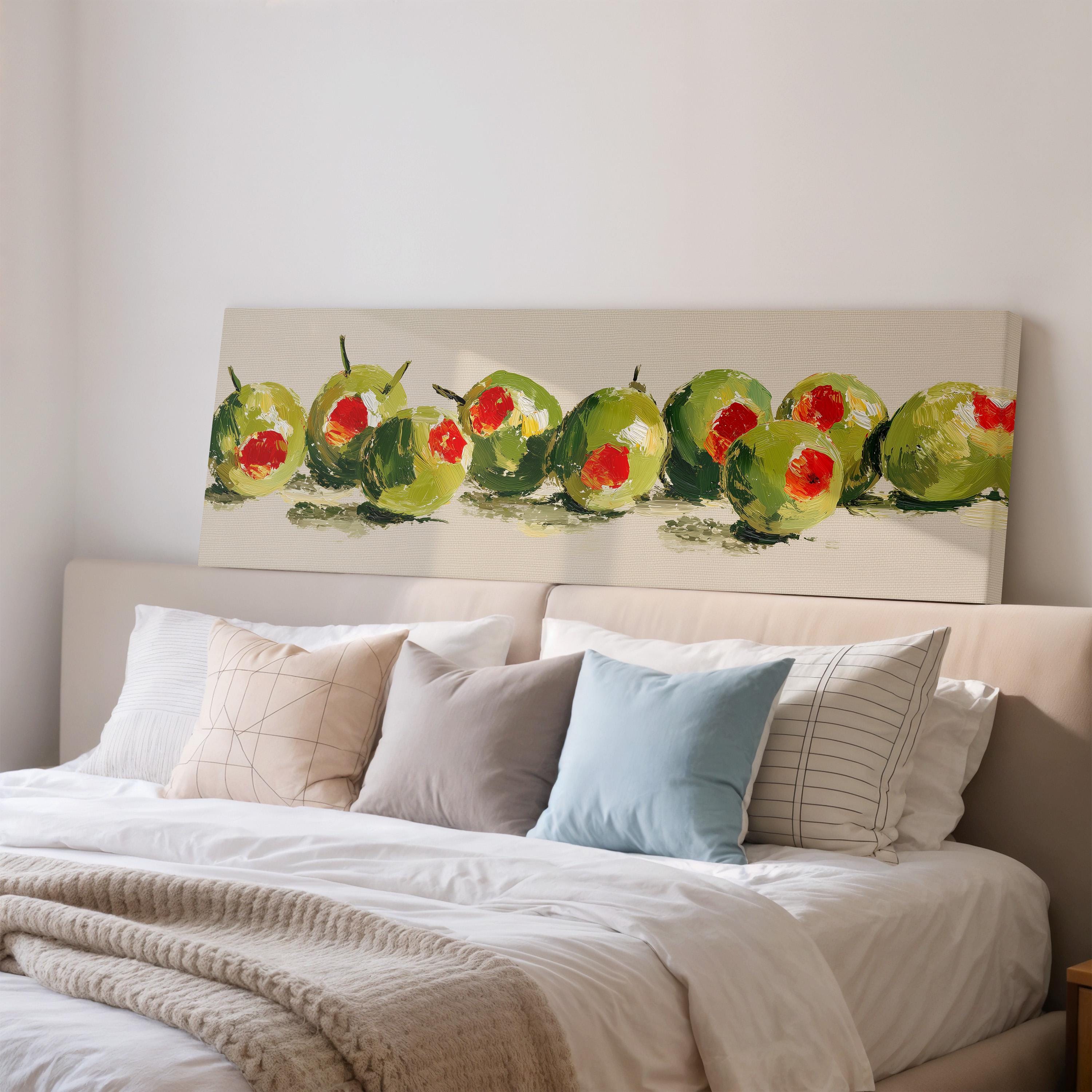 a bedroom with a bed and a large painting of green and red fruits on the wall above it.
