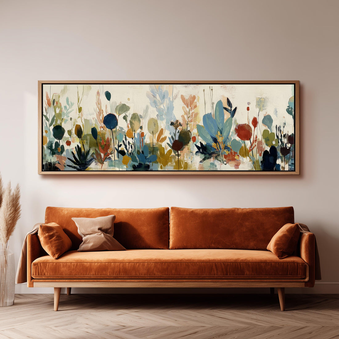 a large, colorful painting of flowers hanging on a wall above a brown sofa with orange cushions.