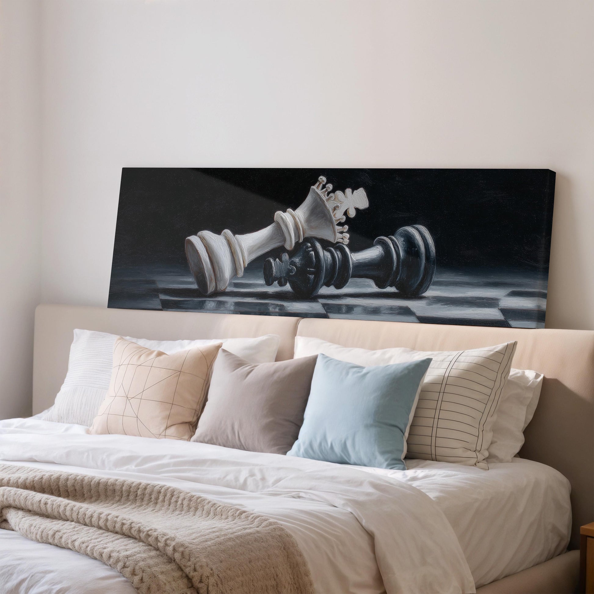 a large black and white painting of a chess king resting on a bed, with a white headboard and a beige comforter.