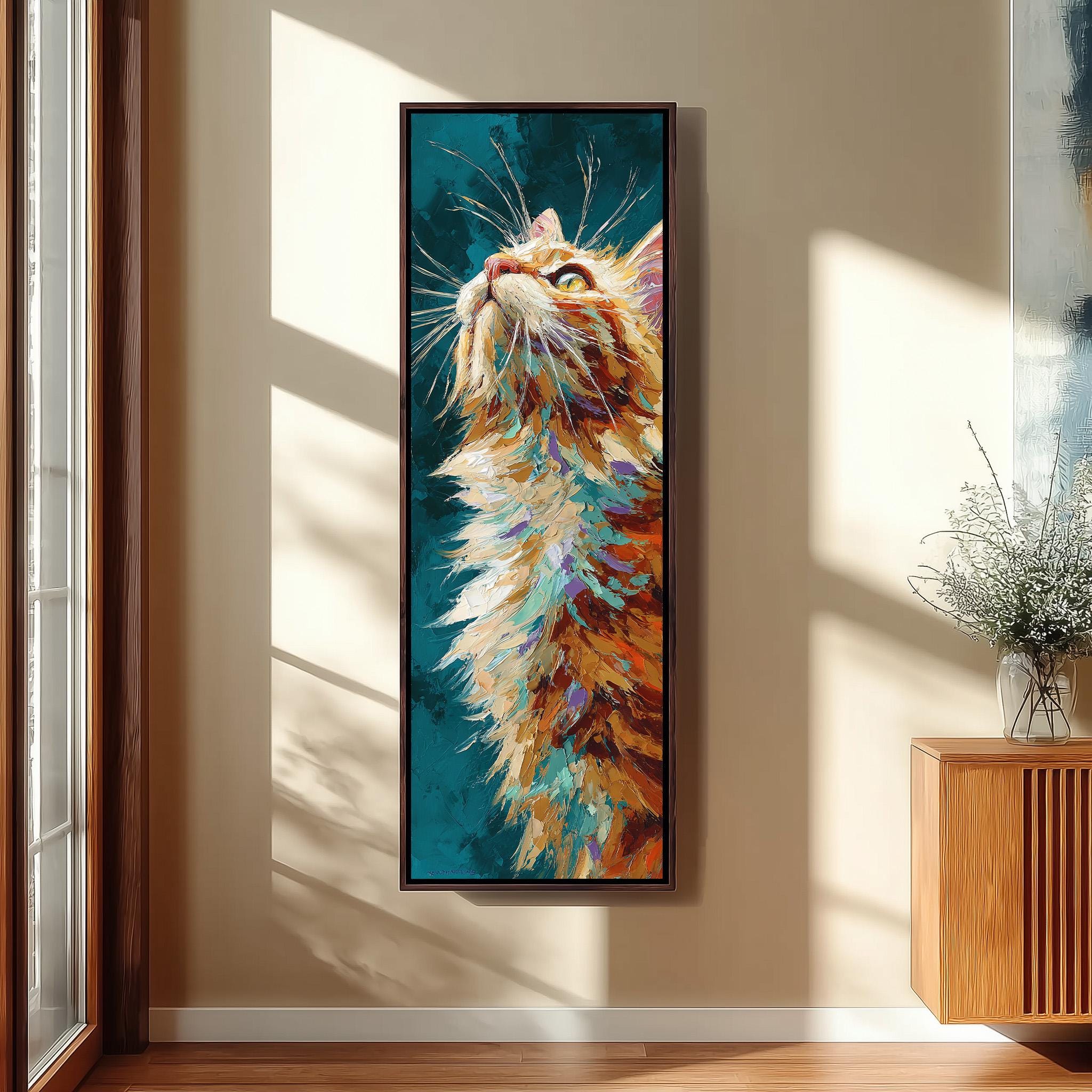a large, colorful painting of a cat's face hanging on a wall.