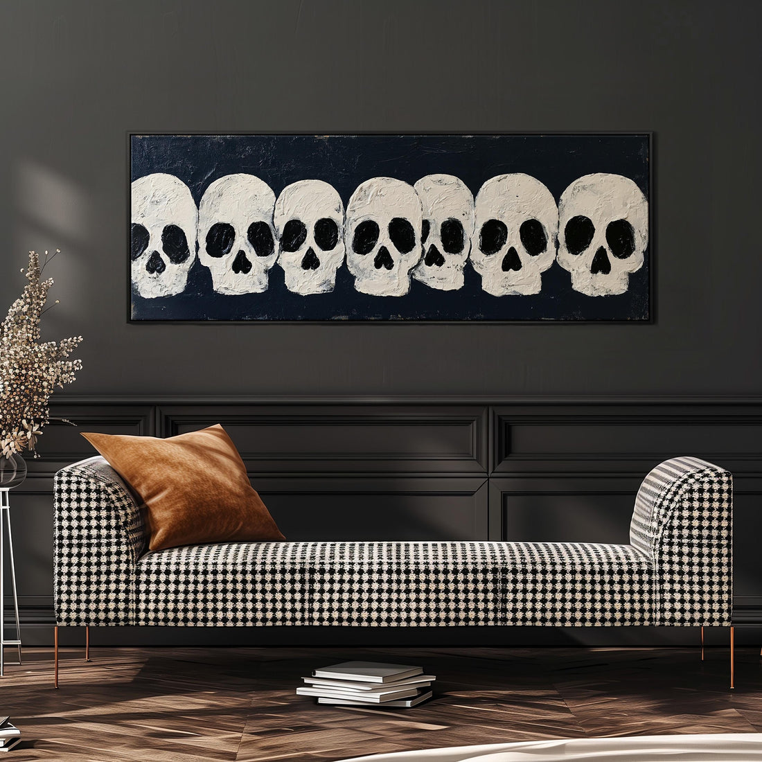 Row of white skulls on navy long horizontal canvas print above a sofa in a living room