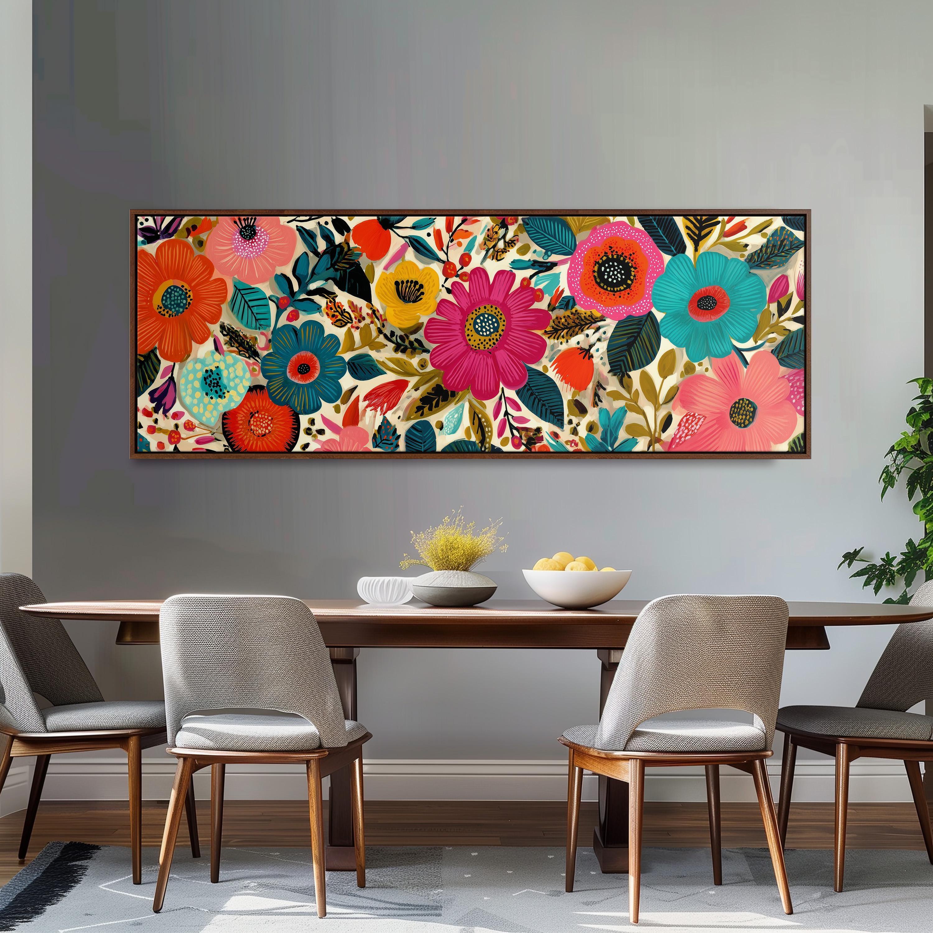 a dining room with a large, colorful floral artwork hanging on the wall above a wooden dining table. The table is set with a bowl of fruit and a vase of flowers, creating a welcoming and vibrant atmosphere.