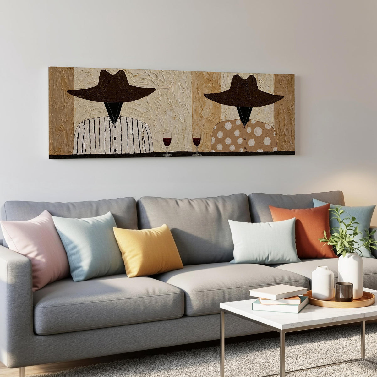 Two folk figures in hats toasting with red wine panoramic canvas print above a grey sofa in a living room