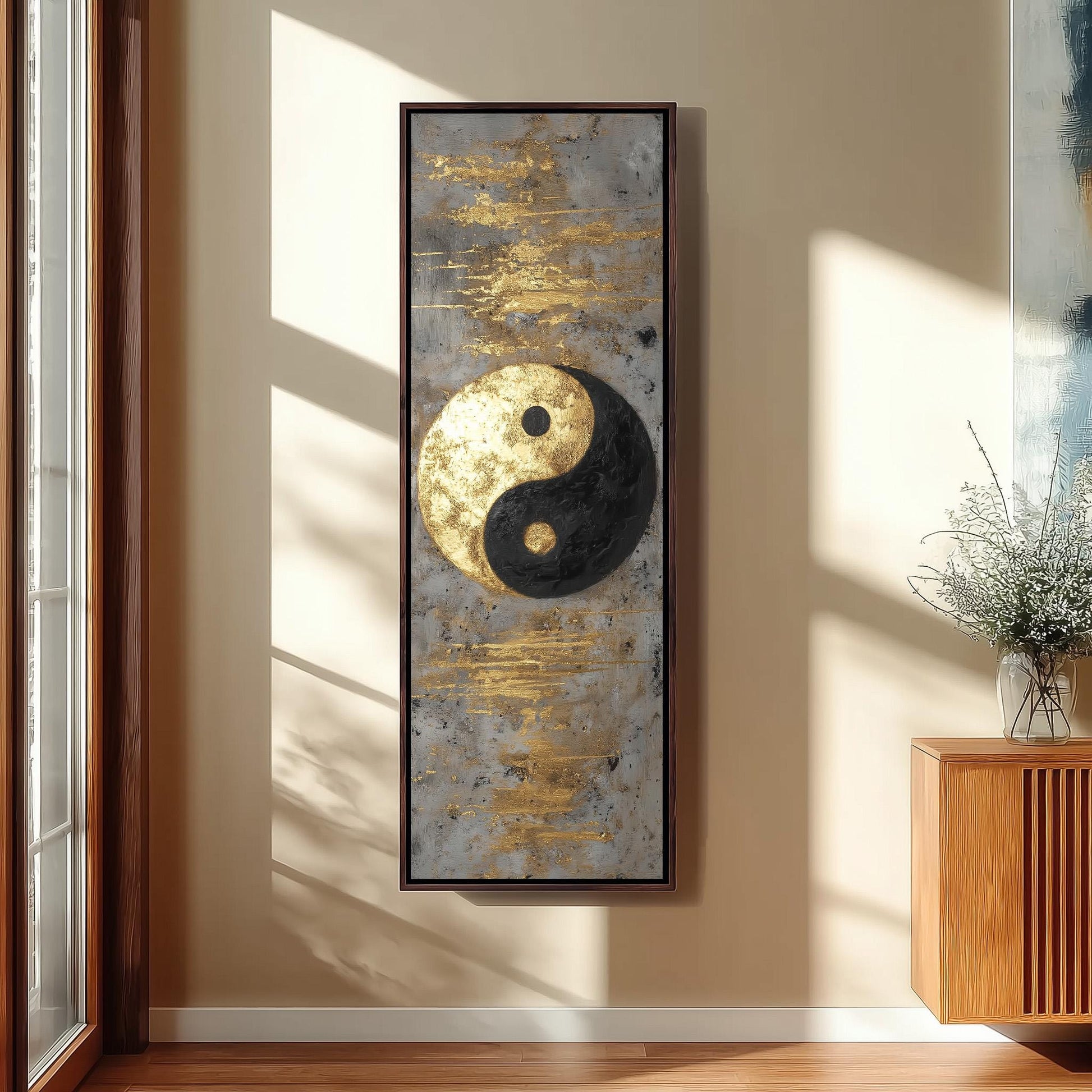 a large framed artwork hanging on a wall, depicting a yin and yang symbol.