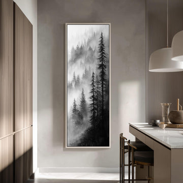 a large black and white painting of a forest scene hanging on a wall in a modern kitchen.