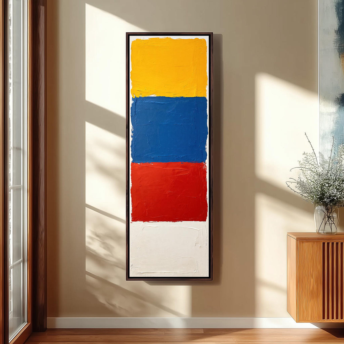 Color field blocks in yellow, blue and red tall skinny canvas print in a sunlit living space
