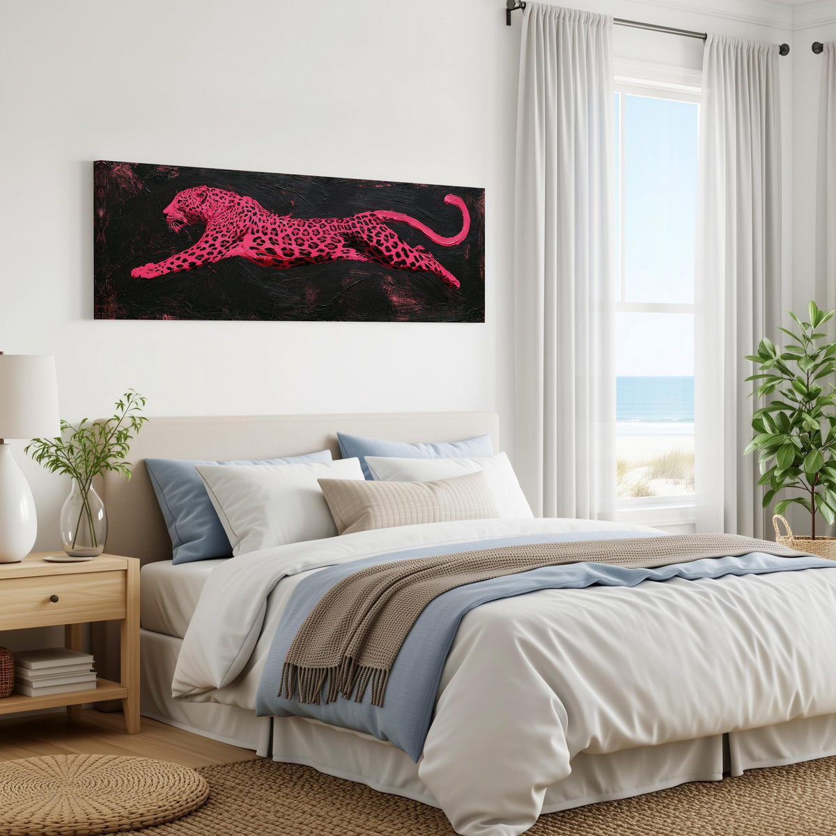 Pink leaping leopard panoramic canvas print above a bed in a coastal bedroom