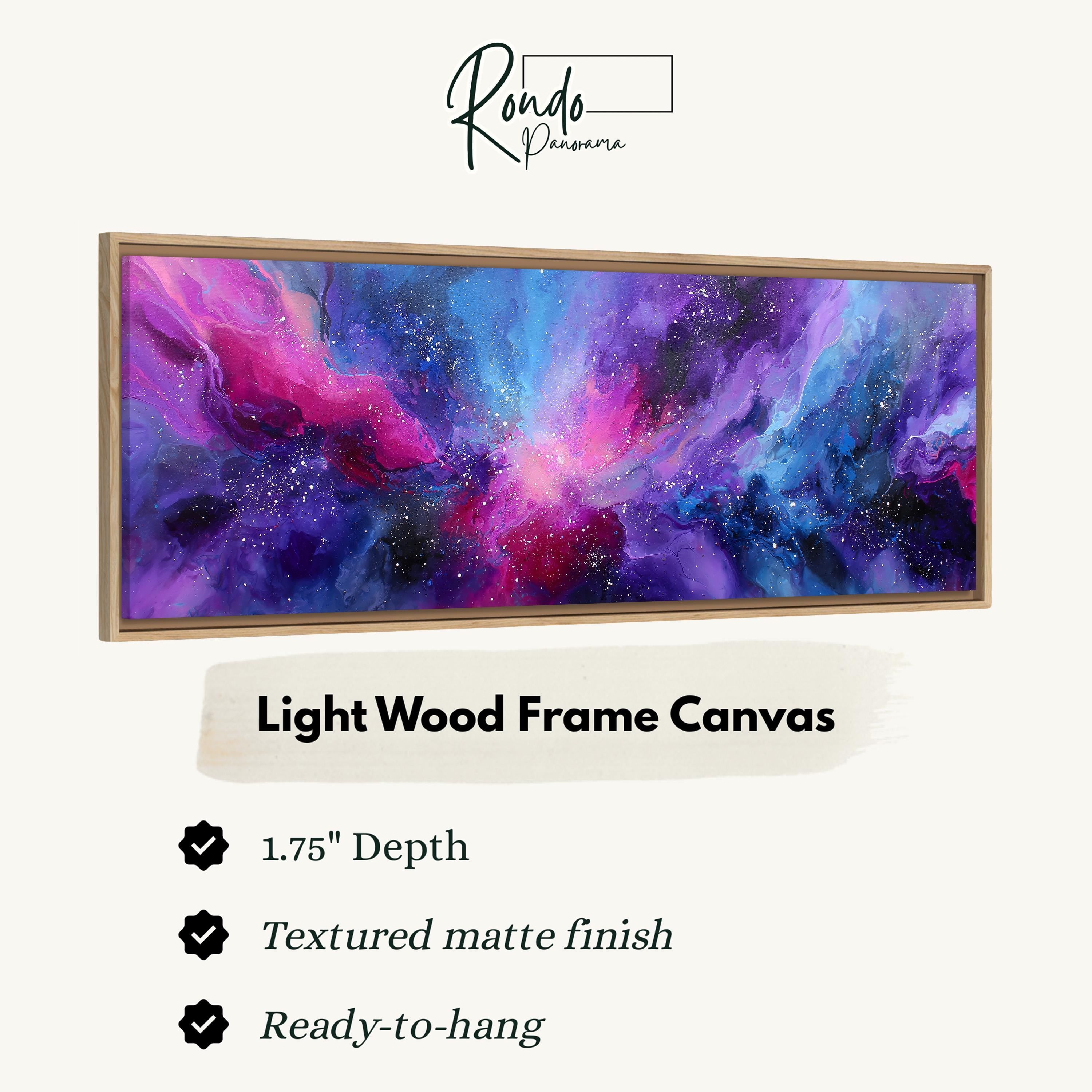 a large, vibrant abstract painting in a light wood frame.